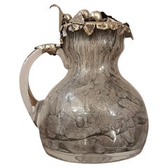 LATE 19th CENTURY GLASS AND SILVER JUG