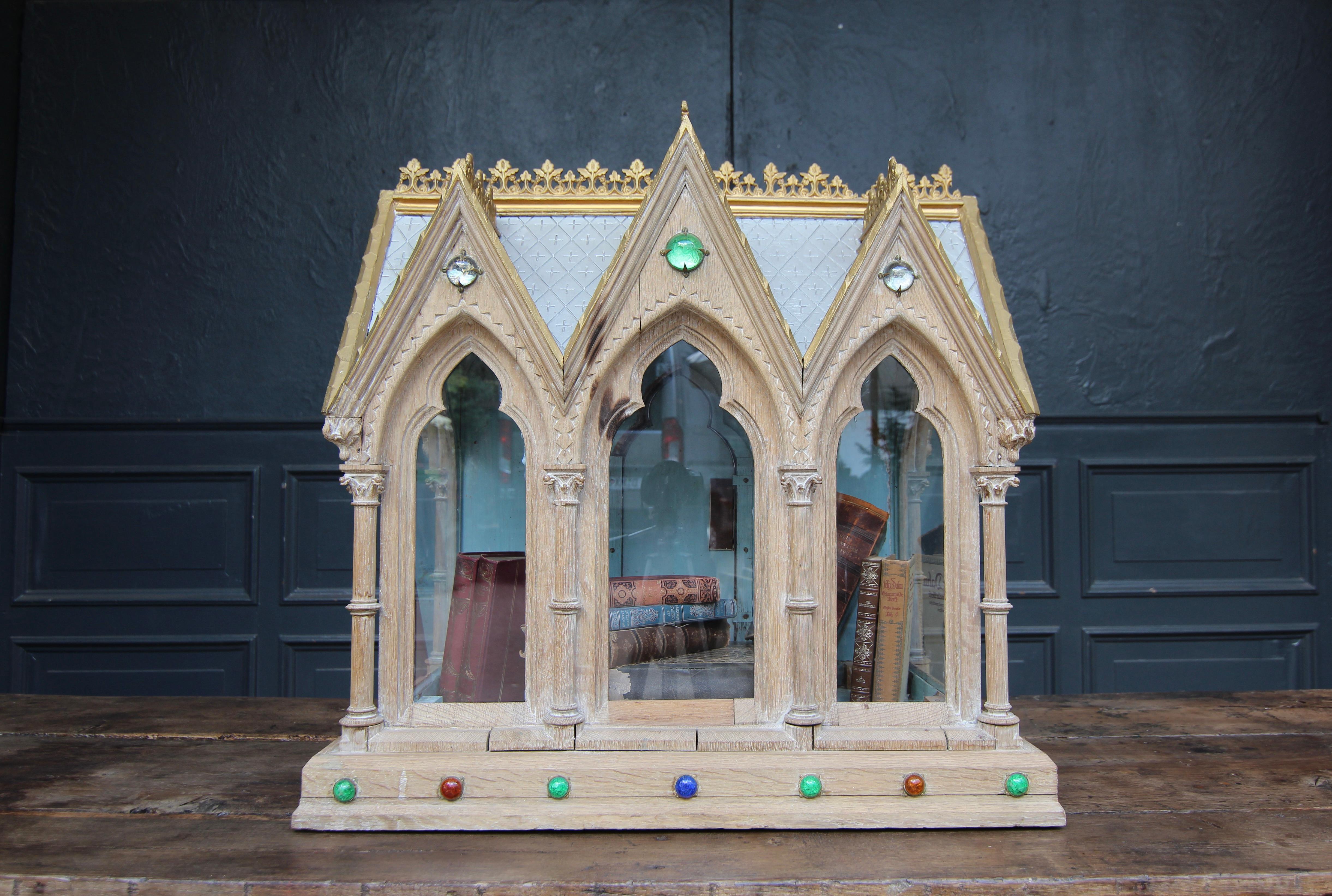 A Gothic Revival reliquary. Circa late 19th / early 20th century. Made of solid oak with fine carving.

Reliquaries have been used to store relics since the Middle Ages. In sacred architecture they are often located behind the main altar in the