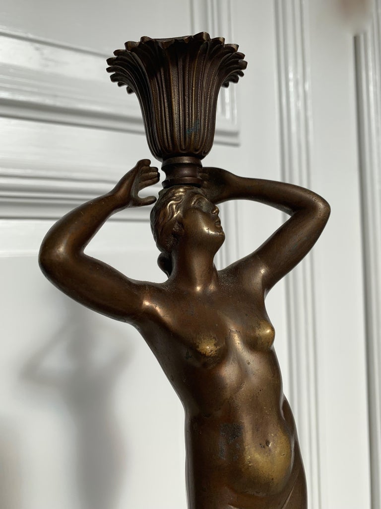 Elegant and highly stylish candlestick or table lamp.

This handcrafted and heavy quality, bronze candle stick or table lamp from the 1890-1910 era is in very good condition. This roman classical antique has an amazing look and feel and it has the
