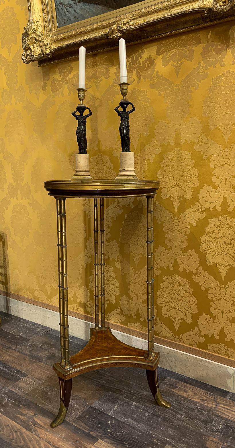 Late 19th century gueridon table in the style of Adam Weisweiler. 

Late 19th century, a fine French Louis XVI marble-top and gilt bronze gueridon table. Based on a design by Adam Weisweiler.

Constructed in Grey of Belgium marble, mahogany, and
