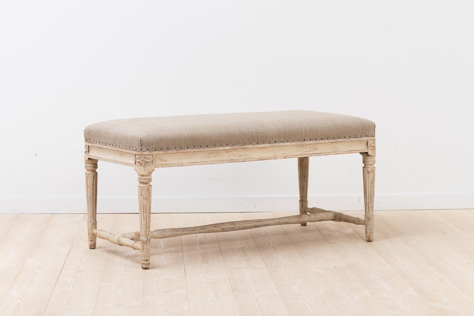 Bench in Gustavian style. The seat has been reupholstered with linen fabric.
Manufactured during the late 1800s in Sweden.