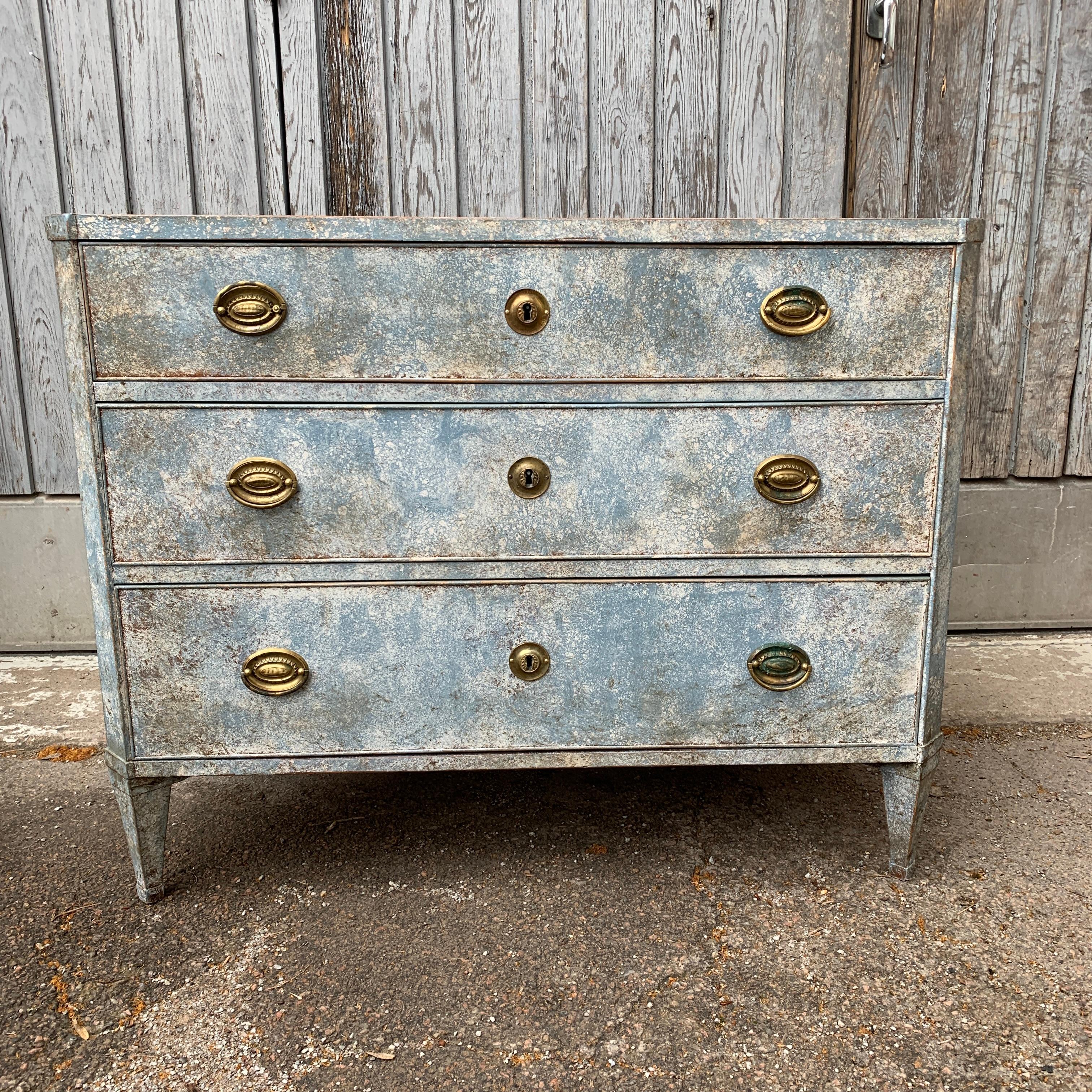 Late 18th Century Swedish 3 drawers chest with original brass hardware and its Gustavian style blue color that has been restored at a later date. The simplicity of the Scandinavian Folk Art style 