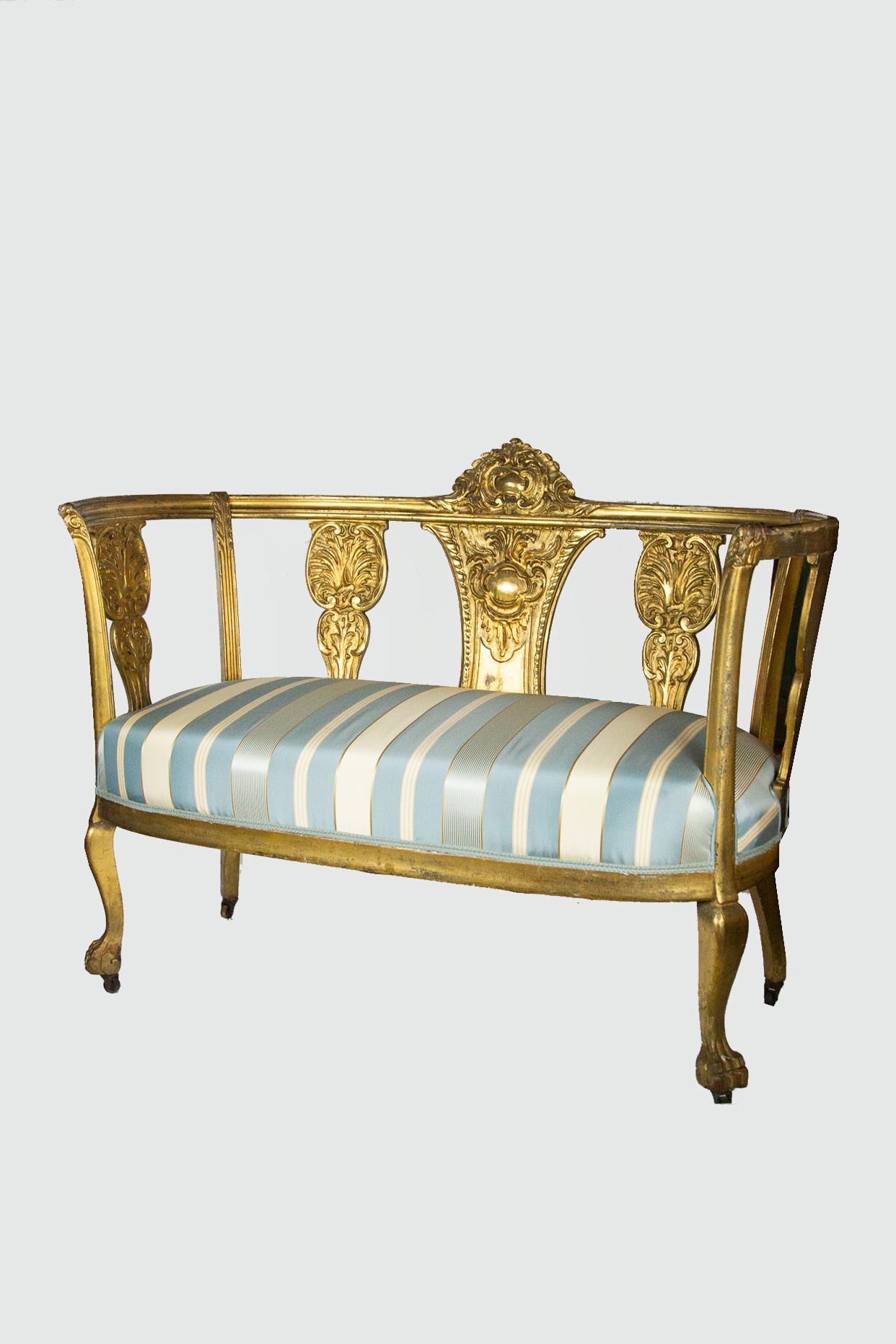 Late 19th century Gustavian style gilt settee and matching chair newly reupholstered. Former restorations and repair to back left leg of settee. On Casters.