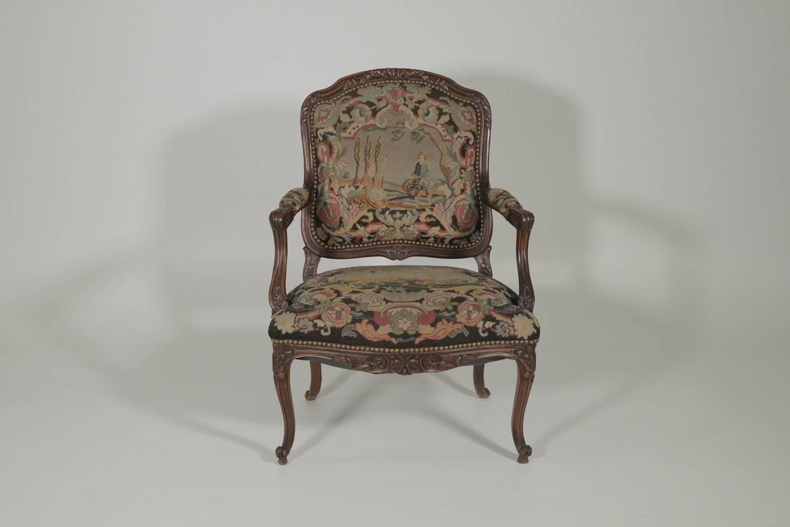 Late 19th century hand-carved French armchair with needlepoint tapestry beautifully hand-carved walnut frame with skilled needlework upholstery.
 