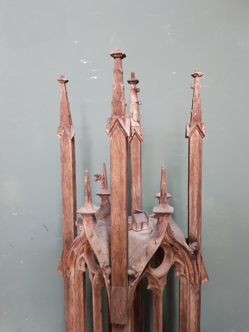 Antique handmade large oak tower model in Gothic style that is clearly reflected in the windows and the pinnacles on the roof, is in a good condition but has some traces around by age. Originating from the end of the 19th century or early 20th