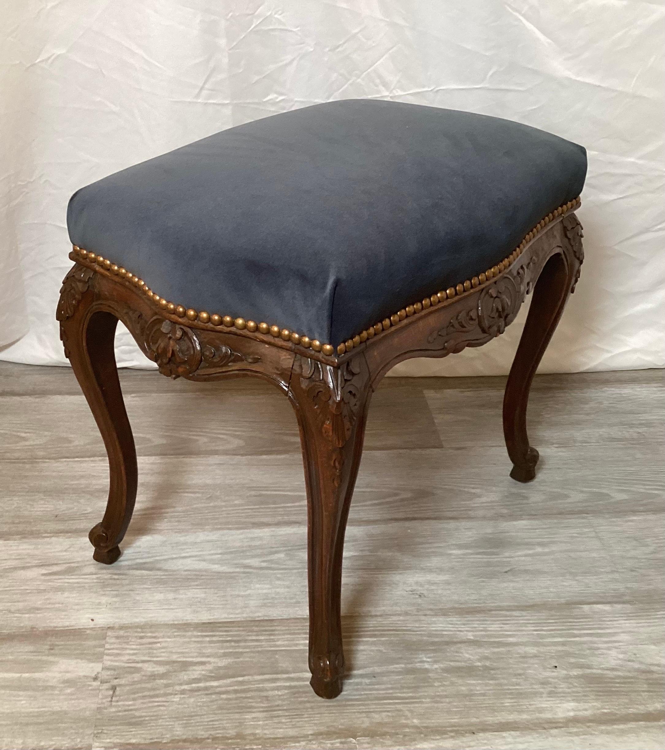 Classic hand carved walnut louis XV style dark gray blue velvet bench with nail head trim. The wood and finish in excellent condition with new fabric.