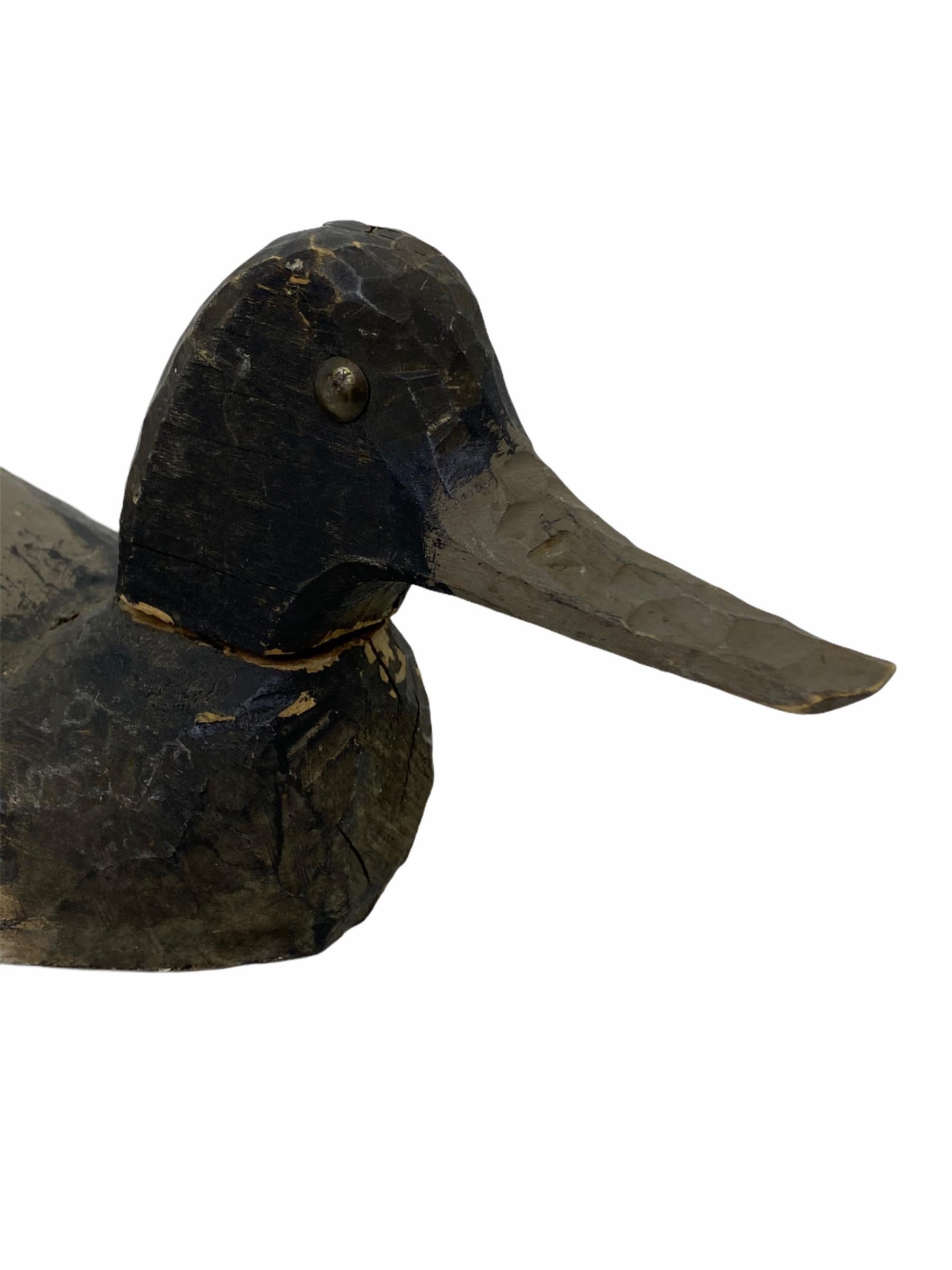 Found in Germany at an estate sale, this hand carved and hand painted duck decoy is perfect for the collector. Well used by a previous hunter the paint has faded through time although the original detail can be seen and admired. Nice Folk Art