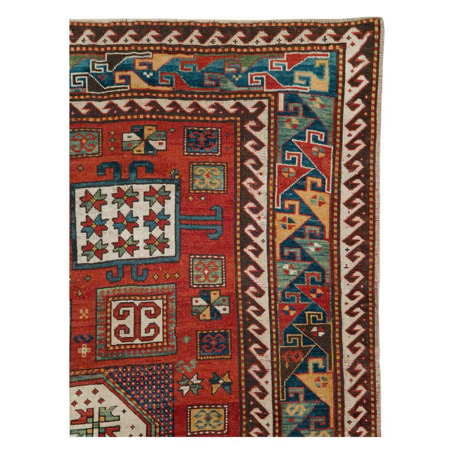 An antique Caucasian Kazak accent rug handmade during the late 19th century.

Measures: 6' 3
