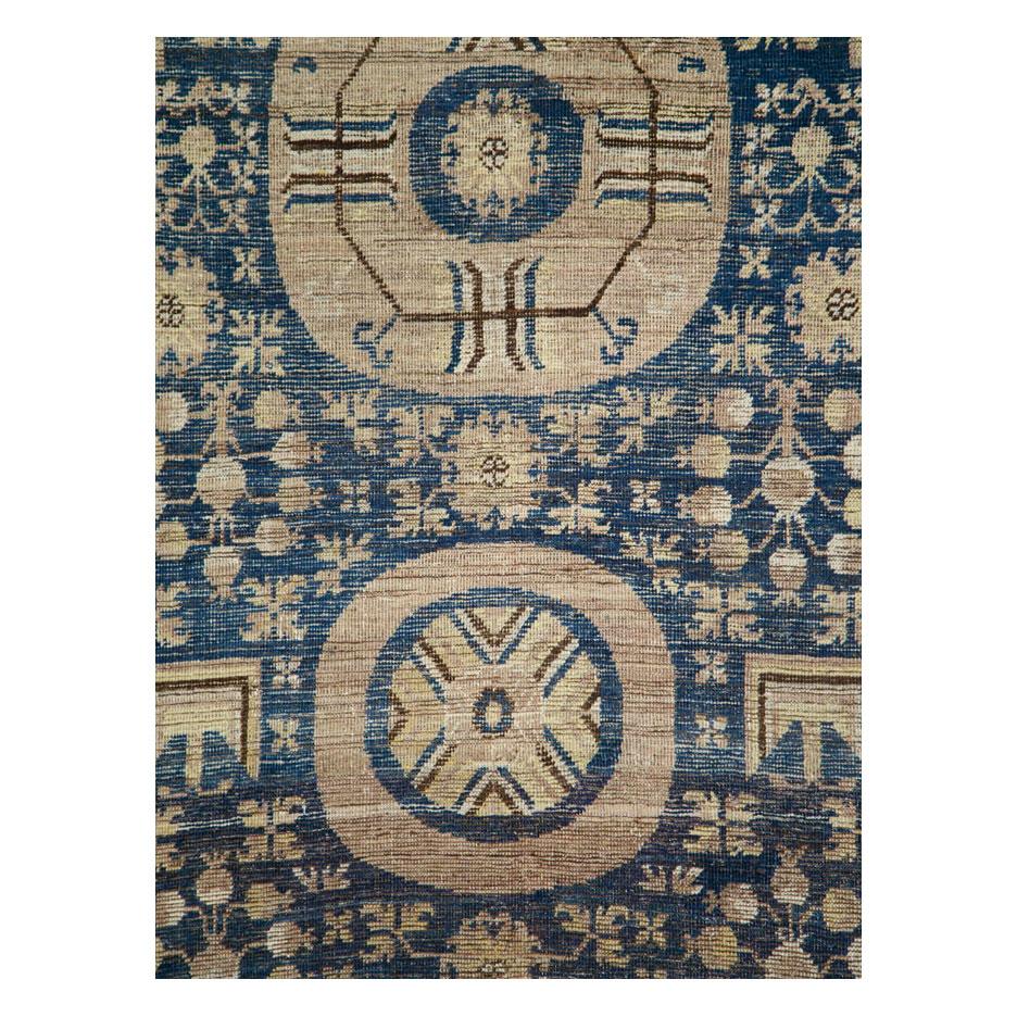 An antique East Turkestan Khotan gallery carpet handmade during the late 19th century.

Measures: 6' 7