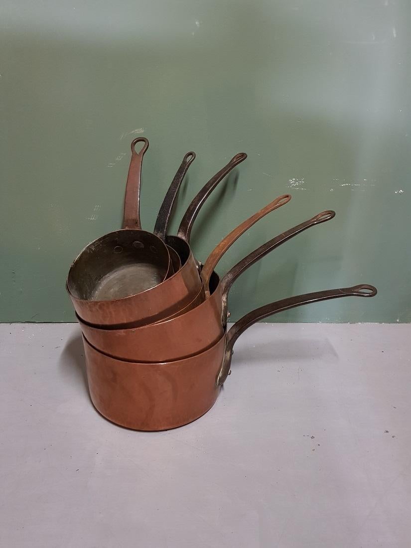 Heavy and large size antique French 6-piece copper pan set with partially tinned interior and metal handles, some are stamped with letters and numbers, late 19th century. 

The measurements are,
Diameters 16, 18, 20.5, 21.5, 23.5 and 24.5 cm/