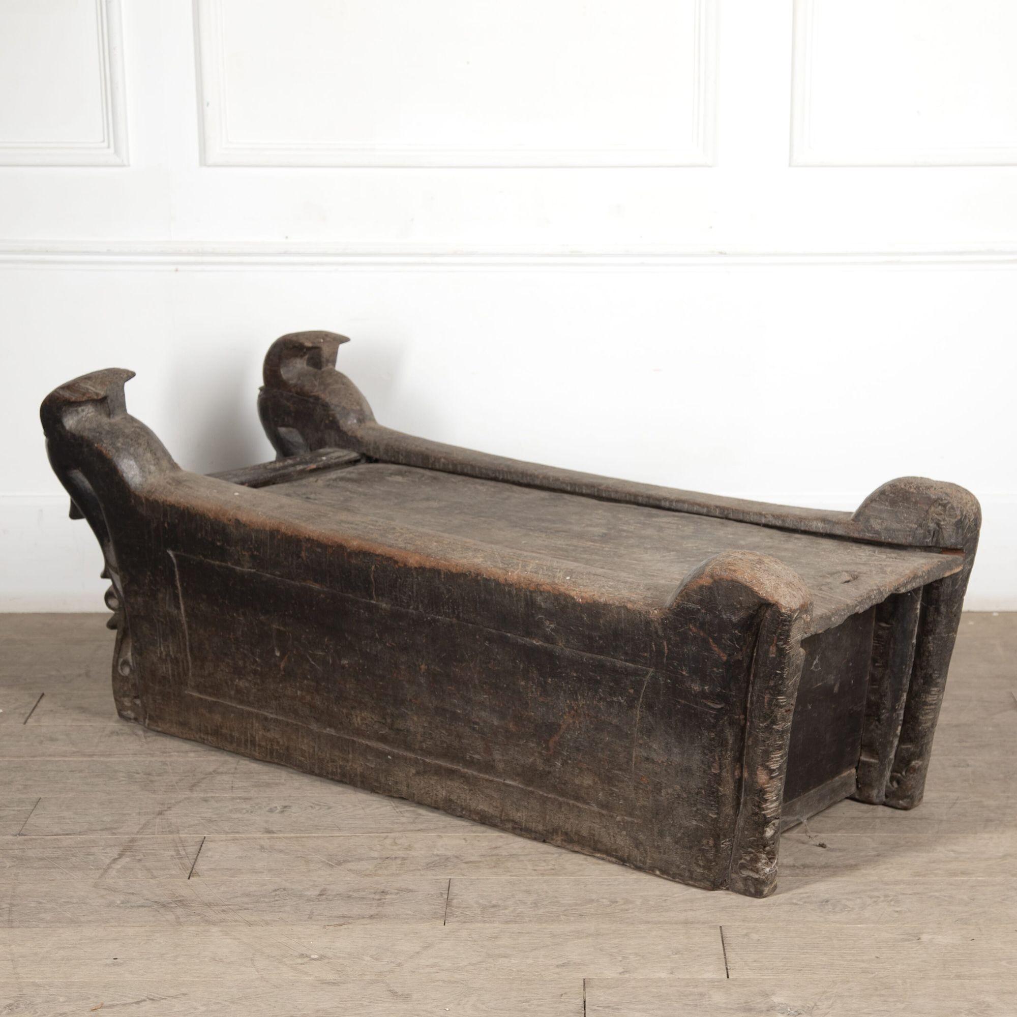 Late 19th century Indonesian Batak Toba domestic chest/child's bed.
With a sliding top and stylised head corner with Singa creature pillars, found in Noble houses.
Dating to the latter part of the 19th century to the early 20th century.
A similar