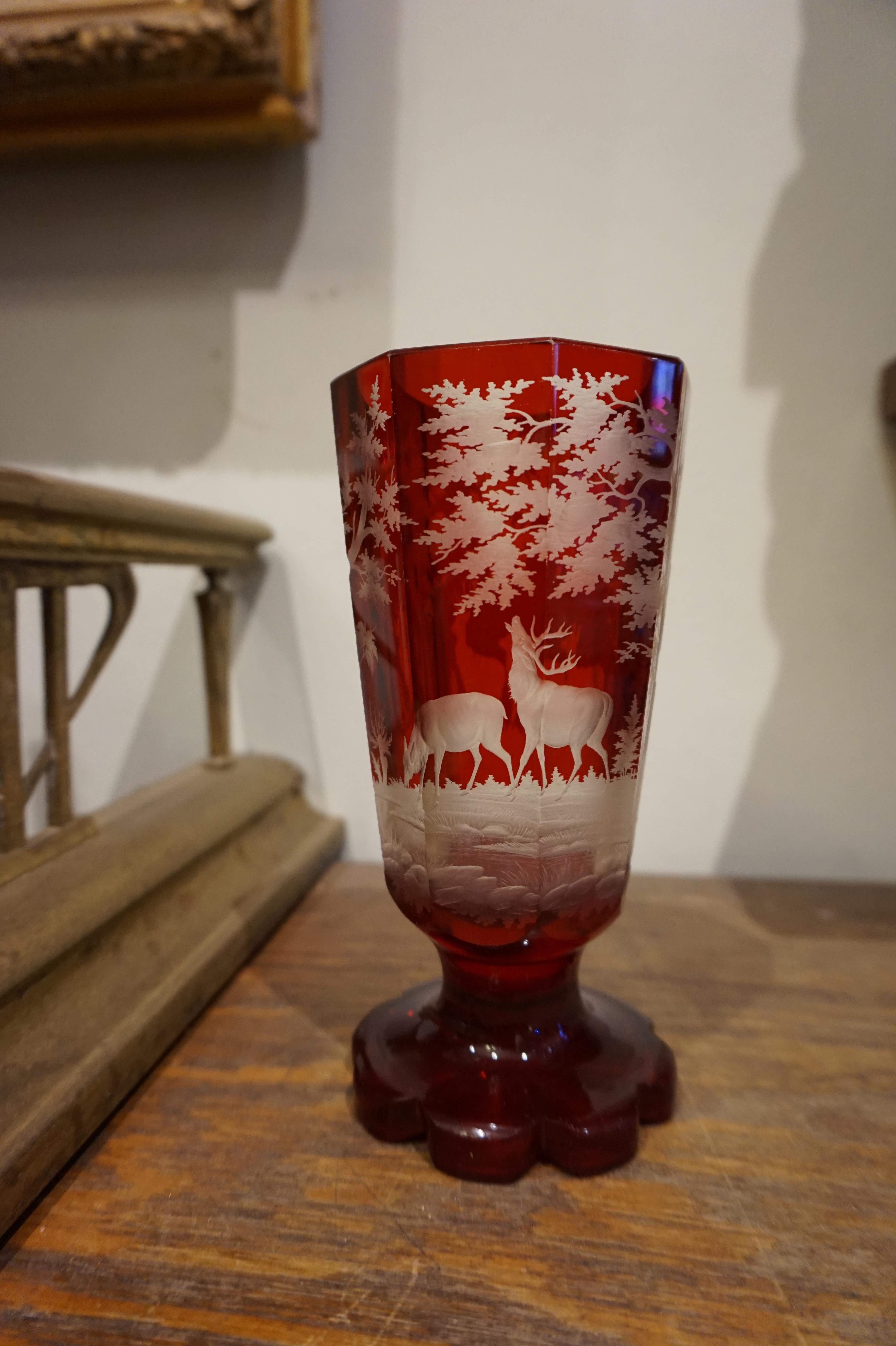 Beautifully hand etched deer in the wilderness scene in Ruby red Crystal. Great details and fine workmanship shines through. Good original condition.
