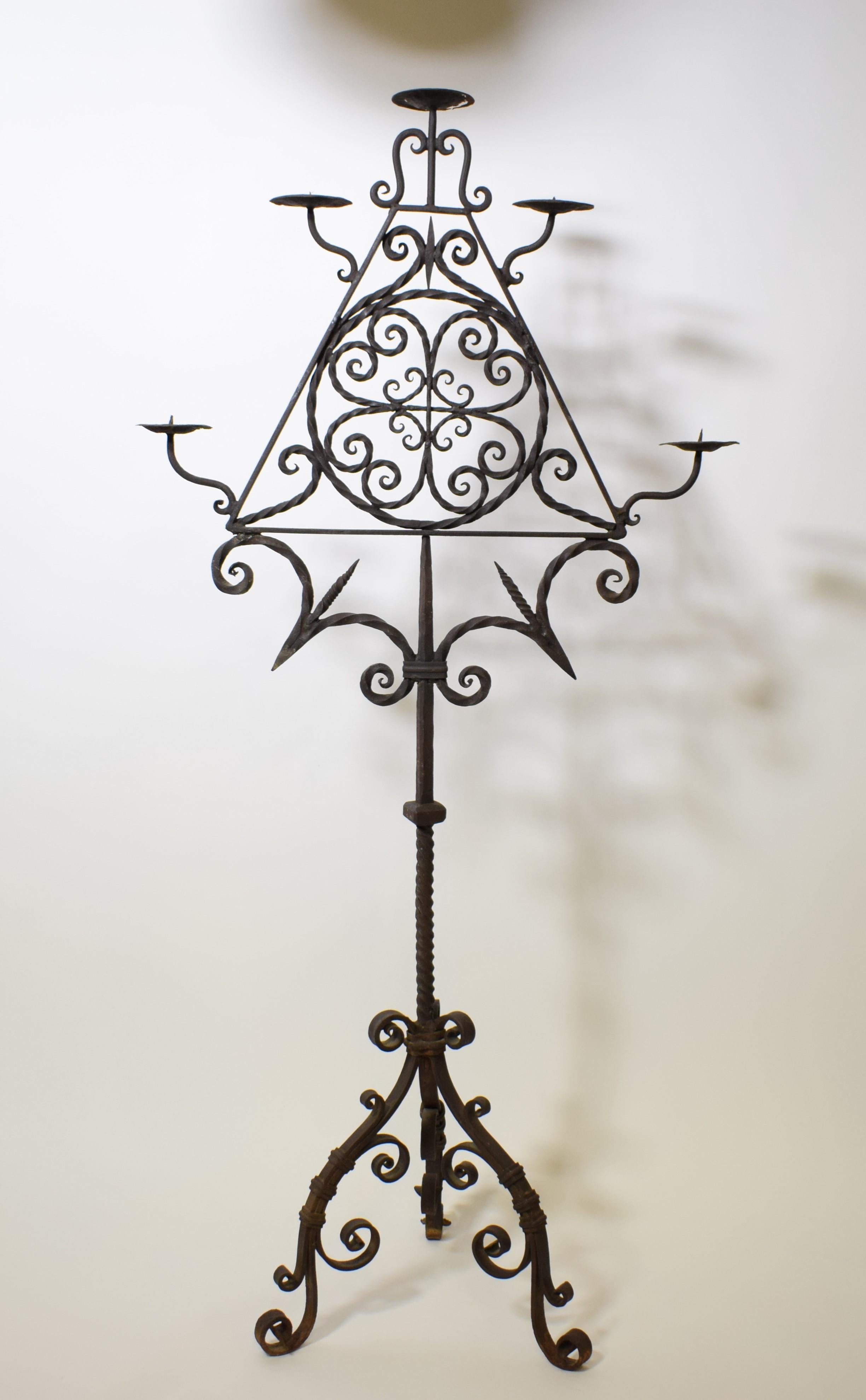Late 19th century iron candelabrum. 
Dimensions: W 30