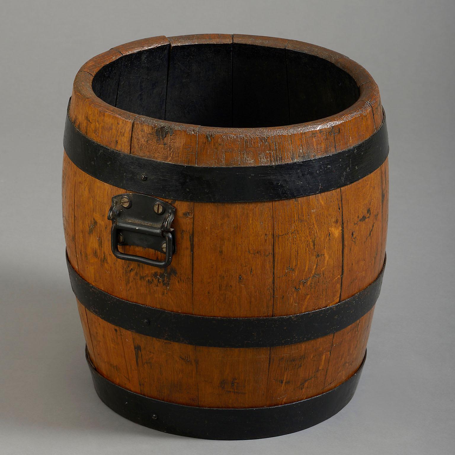 A late nineteenth century iron coopered oak barrel. Formerly a beer barrel, the front and underside carved Courage & Co Alton.

Circa 1890 England

Dimensions: 17 W x 16 D x 17 H inches
43 W x 40.5 D x 43 H cm.