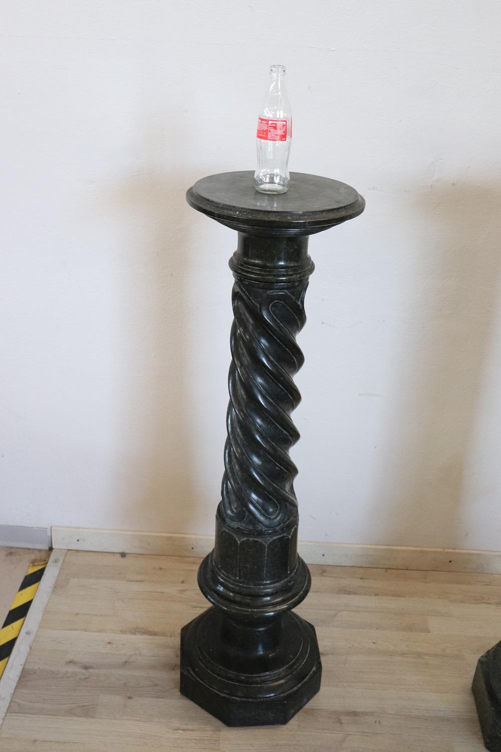 Beautiful late 19th century antique column is made of precious black marble. The body is sculpted with torch pattern. Its dimensions allow you to exhibit sculptures or even large vases such as busts. 