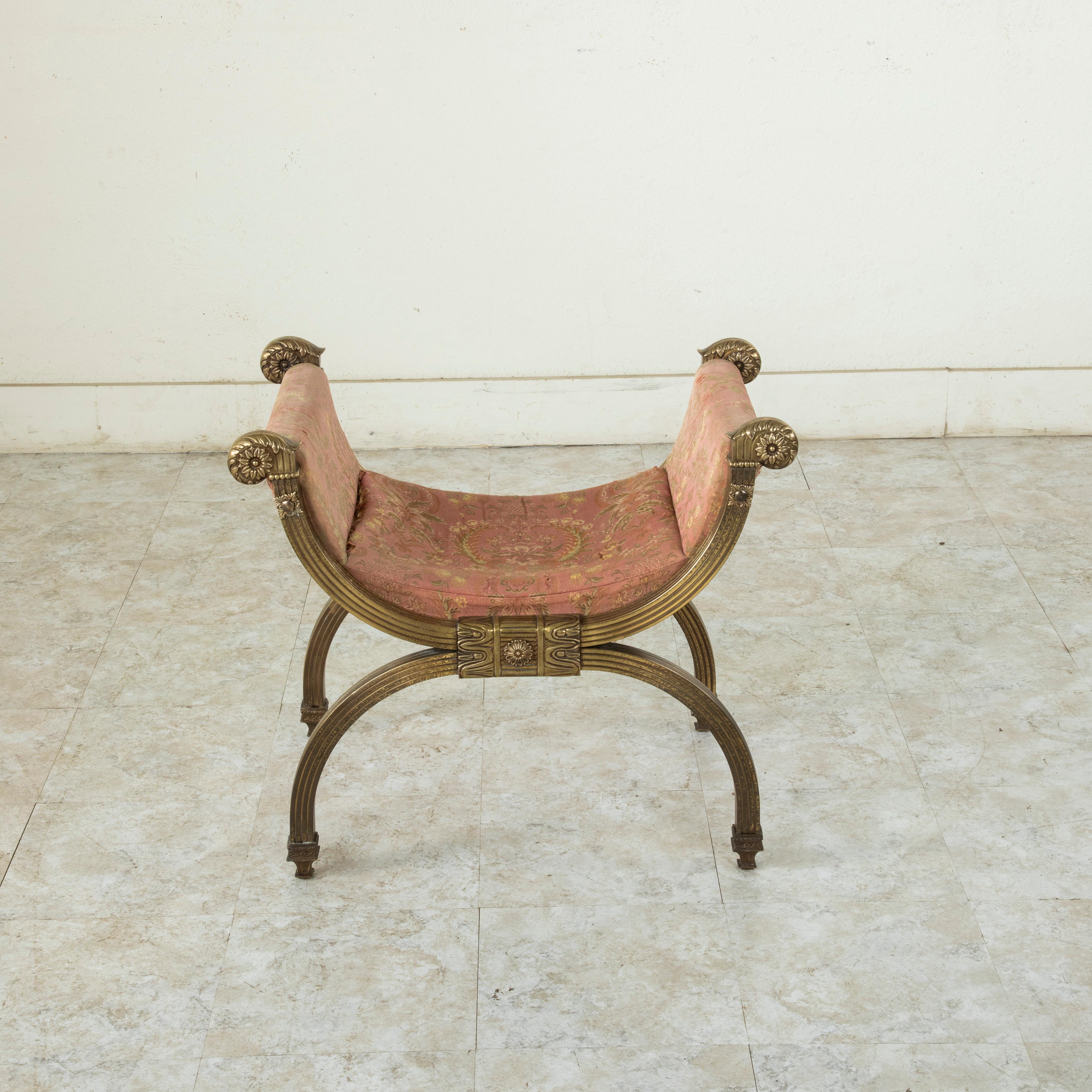 Originally from the area around Milan in northern Italy, this Baroque style solid bronze bench from the late nineteenth century is commonly referred to as a Dagobert. Named after the last king of the Merovingian line, it features the Classic form of