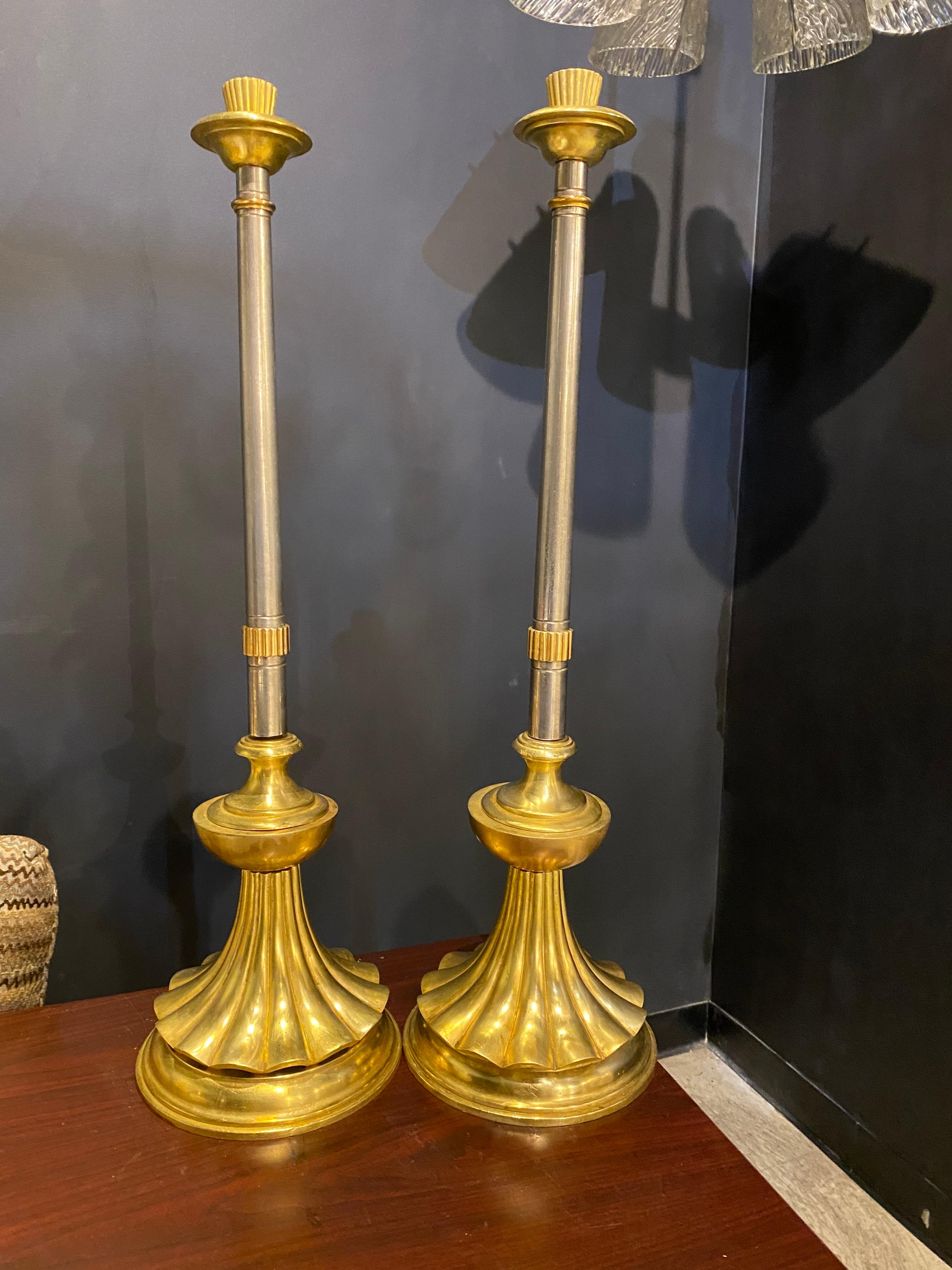 A pair of late 19th Century Italian gilt bronze and silvered metal candle sticks converted into table lamps 