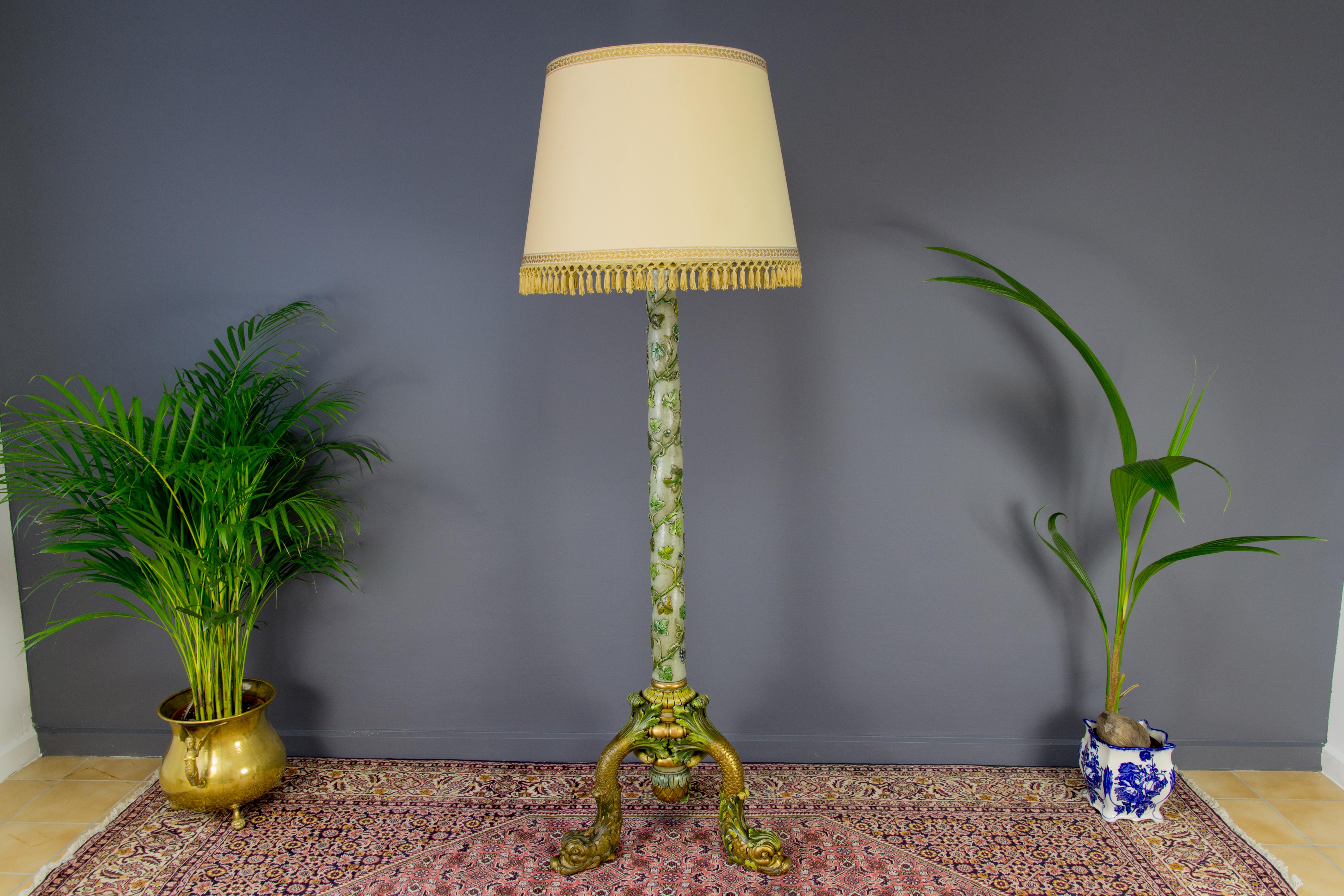 Early 20th-century Italian carved wooden floor lamp with dolphins.
Impressive early 20th century Italian Grotto style wooden floor lamp with carved and in green and golden tones painted meandering grapes and vine leaves. This polychrome antique