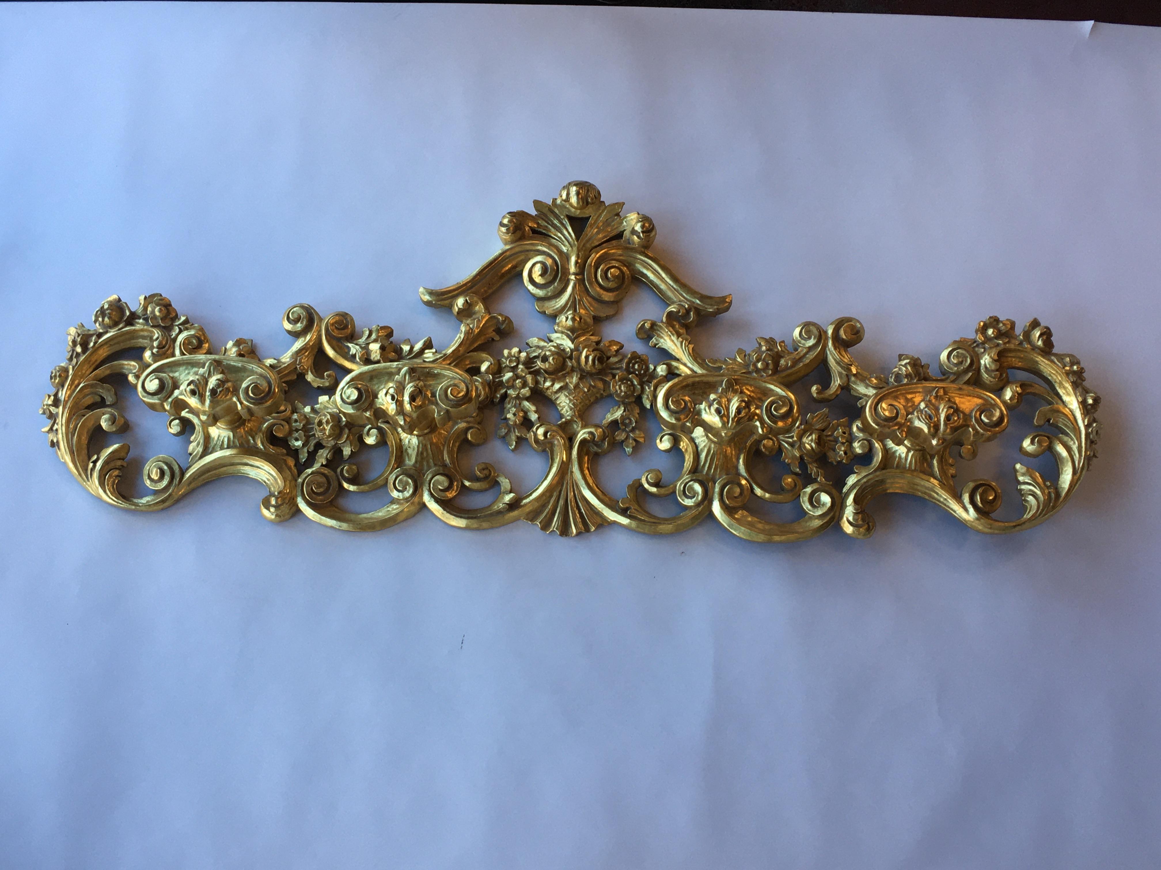 Late 19th century Italian hand carved 22-karat gold coat hanger.