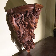 Late 19th Century Italian Hand Carved Walnut Shelf Depicting a Capricious Satyr