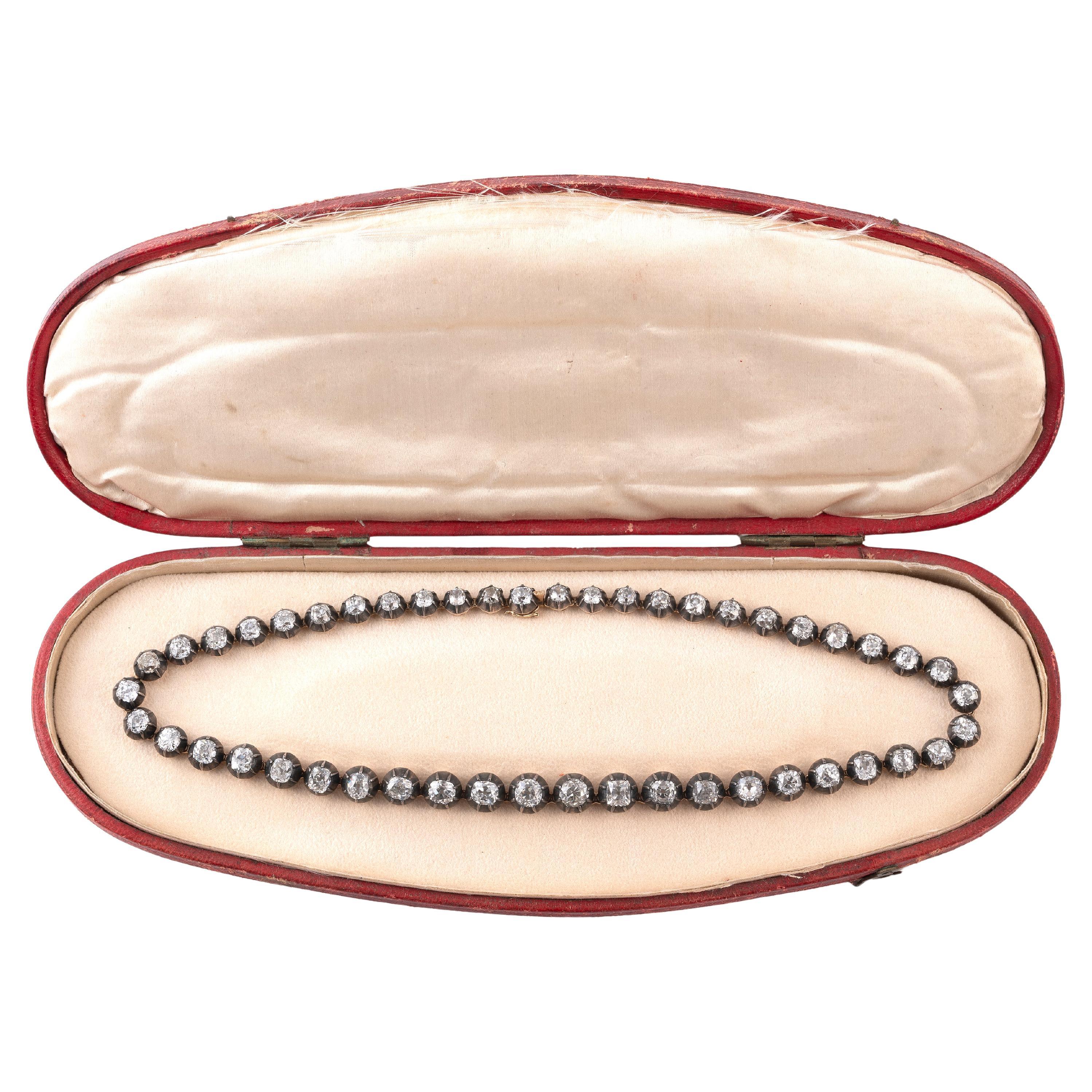 Period: late 19th century
Lenght: 44 cm 
Weight: 56,23 gr

The necklace, attributable to the Italian manufacture of the 1870s, is characterized of a degrading riviere composed of forty-eight cushion-cut and round cut old mine diamonds for a total