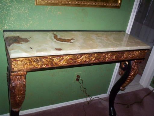 Intricately detailed console with onyx top.

 