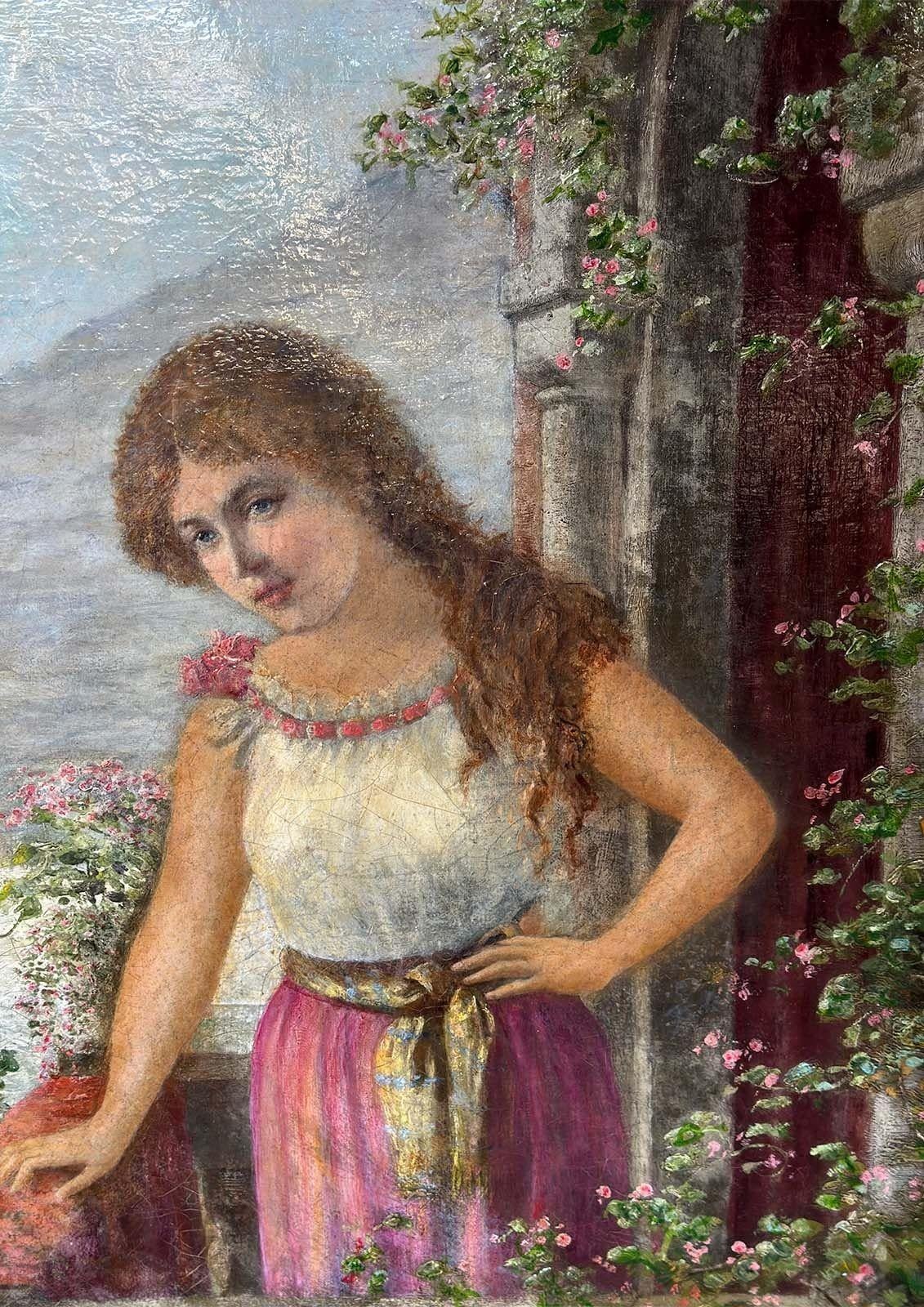 Antique portrait on a hand-carved giltwood frame, depicting a beautiful red-head young lady standing elegantly on a veranda full of colorful flowers. She appears to be overlooking a lake view and mountains in the back. The art piece is signed