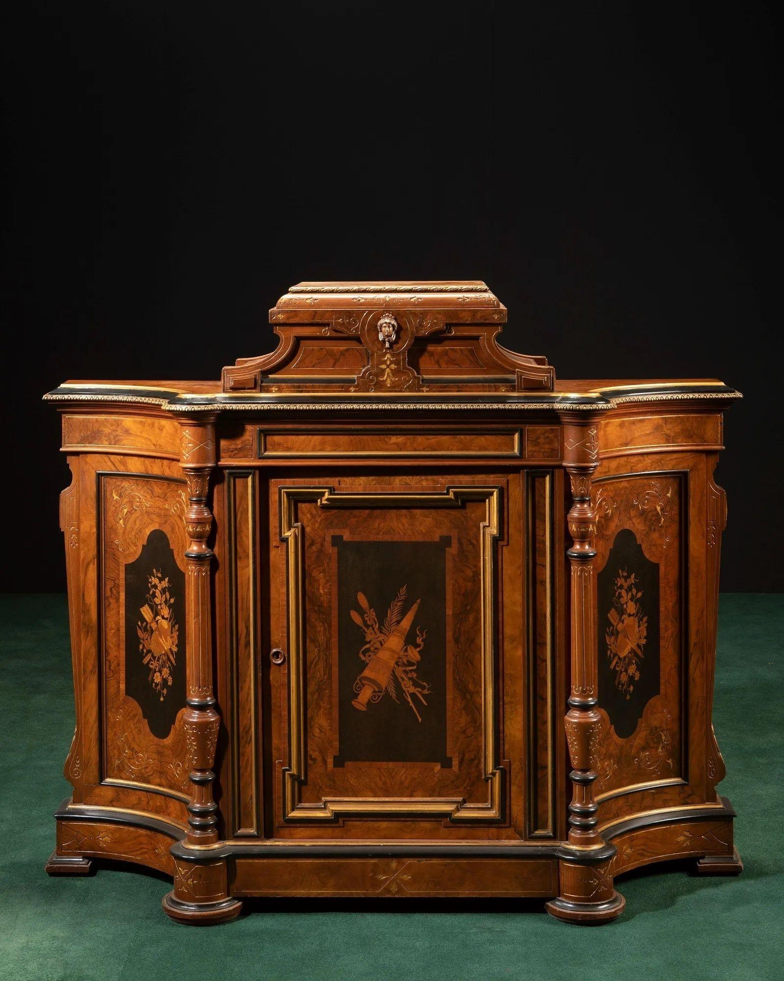 Late 19th century Italian revival cabinet.
 
Carved walnut and burl veneers, ebonized trim with gilt highlights, marquetry panels, bronze trim mounts, single door
 
Dimensions:
 
52.5