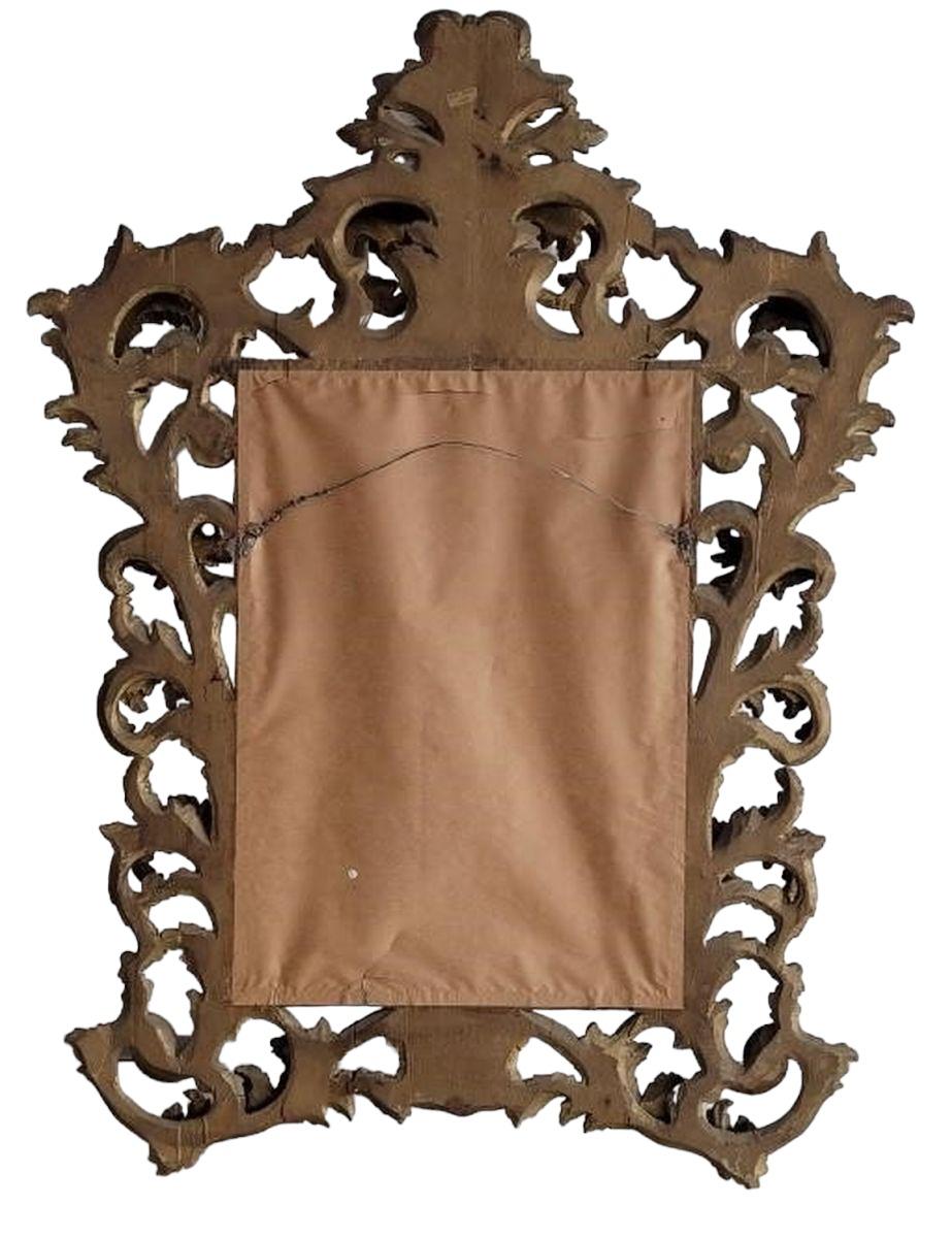 Italian Rococco Hand Carved wooden Wall Mirror. the mirror has beveled edges. Measurements are approx. 46 x 32