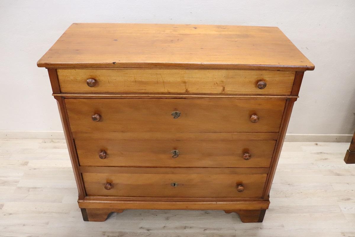 We are pleased to present this fine antique Italian chest of drawers dating back to the late 19th century. Crafted from solid poplar wood, this chest of drawers boasts a sturdy construction that ensures its durability, while its light color tone