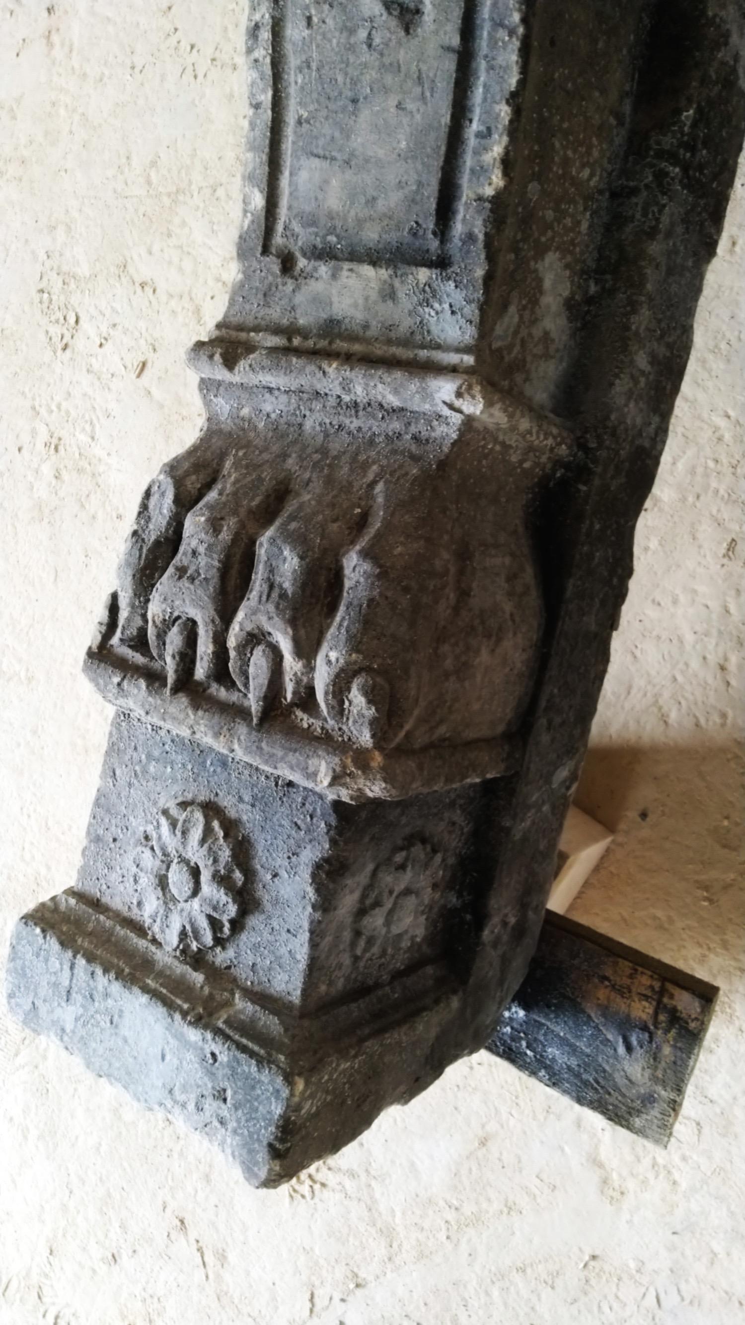 Late 19th century Italian stone fireplace with lions on the legs and lion paw feet.