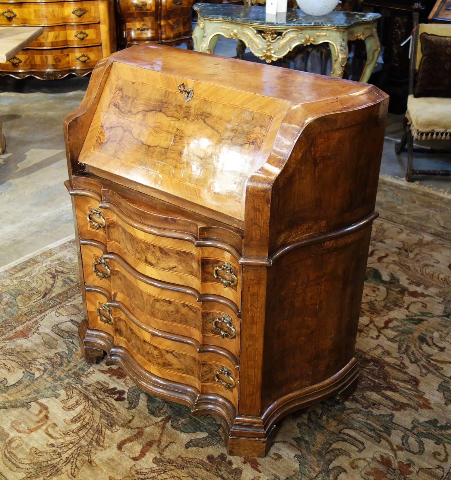 Late 19th Century Italian Walnut Burl Inlaid Louis XIV Secretary Drop Leaf Desk.
Trim three-drawer bureau chest featuring secretary drop lid with lock and key revealing small drawers and compartments. Beautiful walnut veneers and solids with