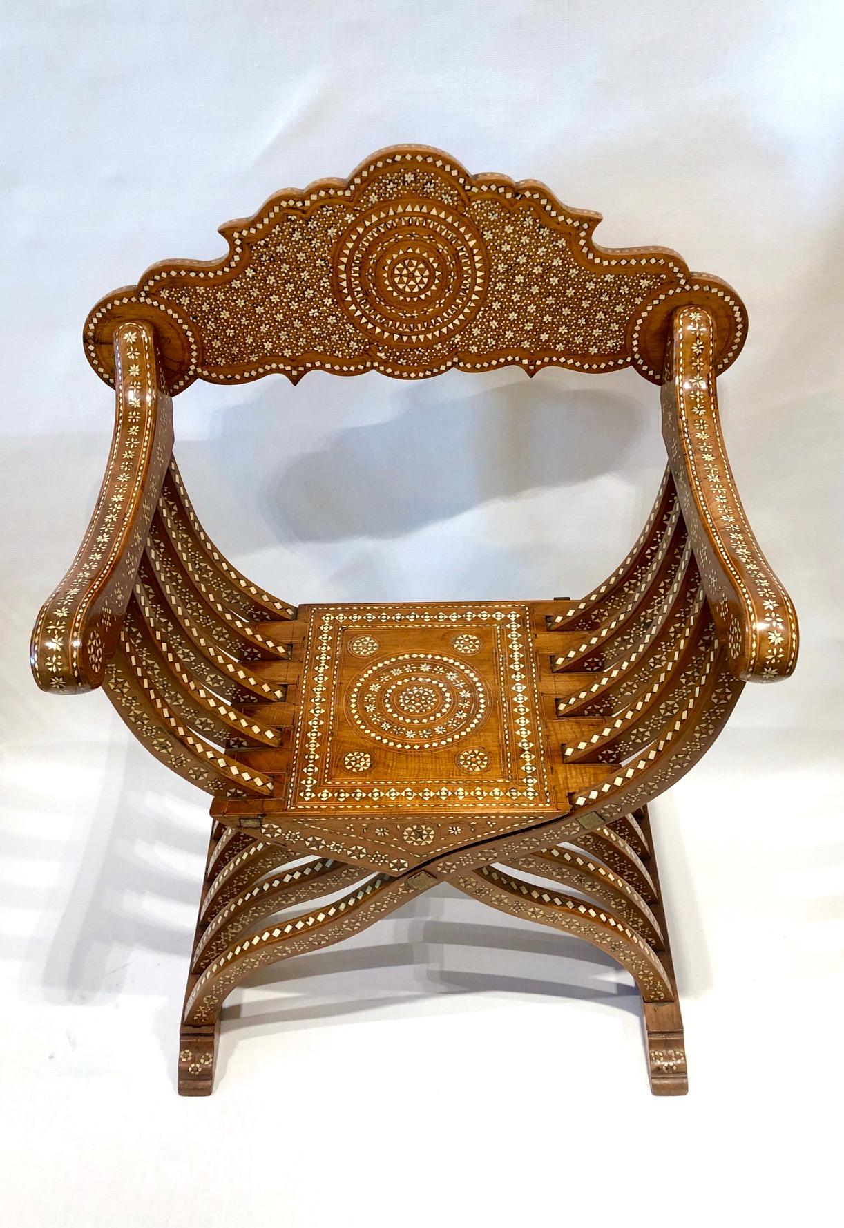 Walnut Savonarola folding chair, made in Italy, circa 1890.

