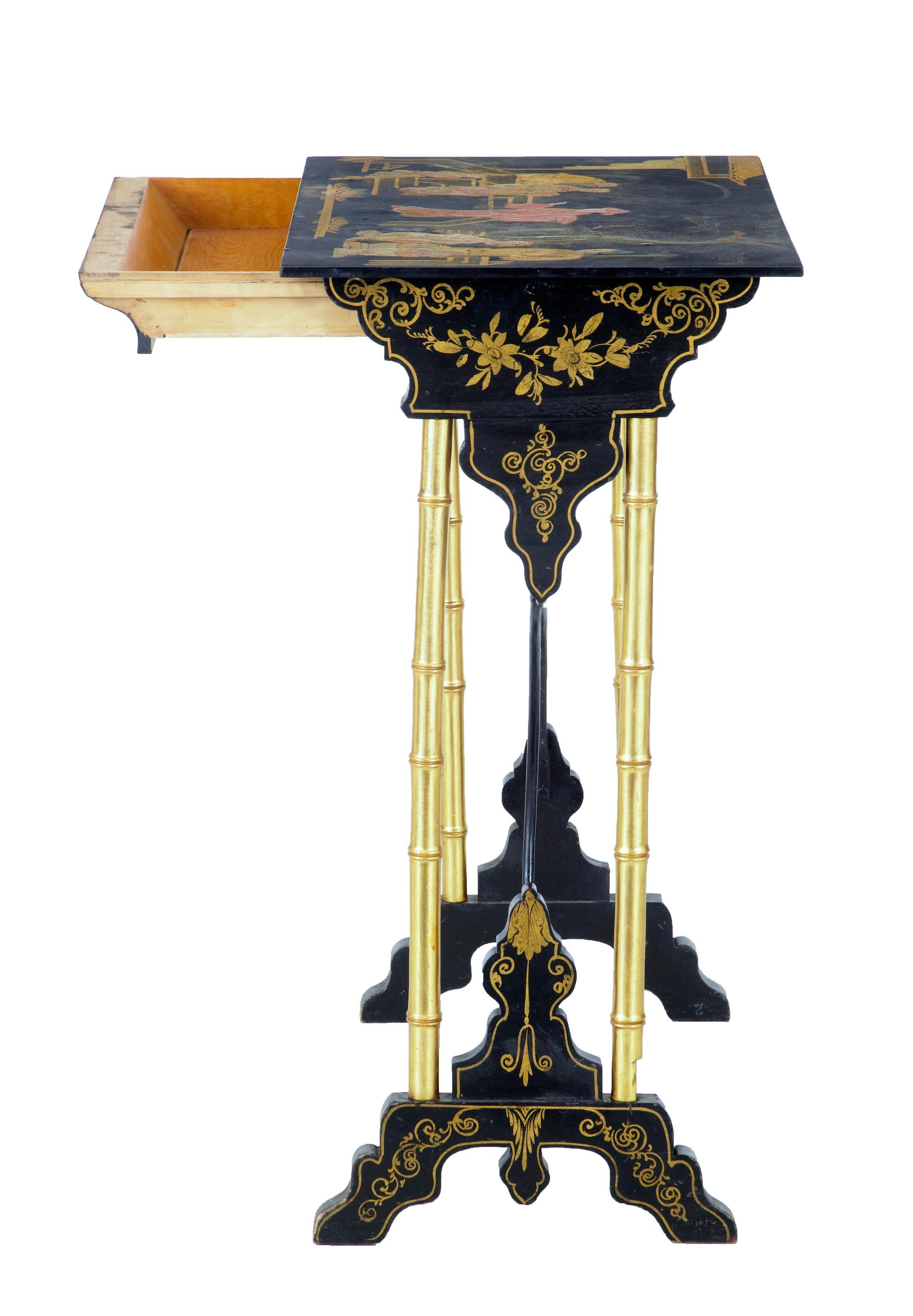 Late 19th century Japanese black lacquer and gilt occasional table circa 1890.

Good quality sewing table. Gilt and painted traditional scene to the top. Single drawer to the front. Hand painted florals to the sides and feet, gilt faux bamboo legs