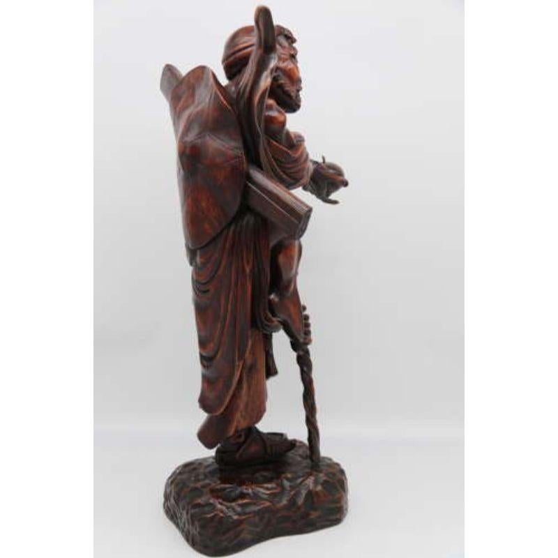 Late 19th C Japanese carved hardwood okimono of a man, circa 1890

This top quality and most impressive large scale Japanese carved hardwood okimono superbly depicts a characterful study of a delightfully crafty looking man. He is dressed simply