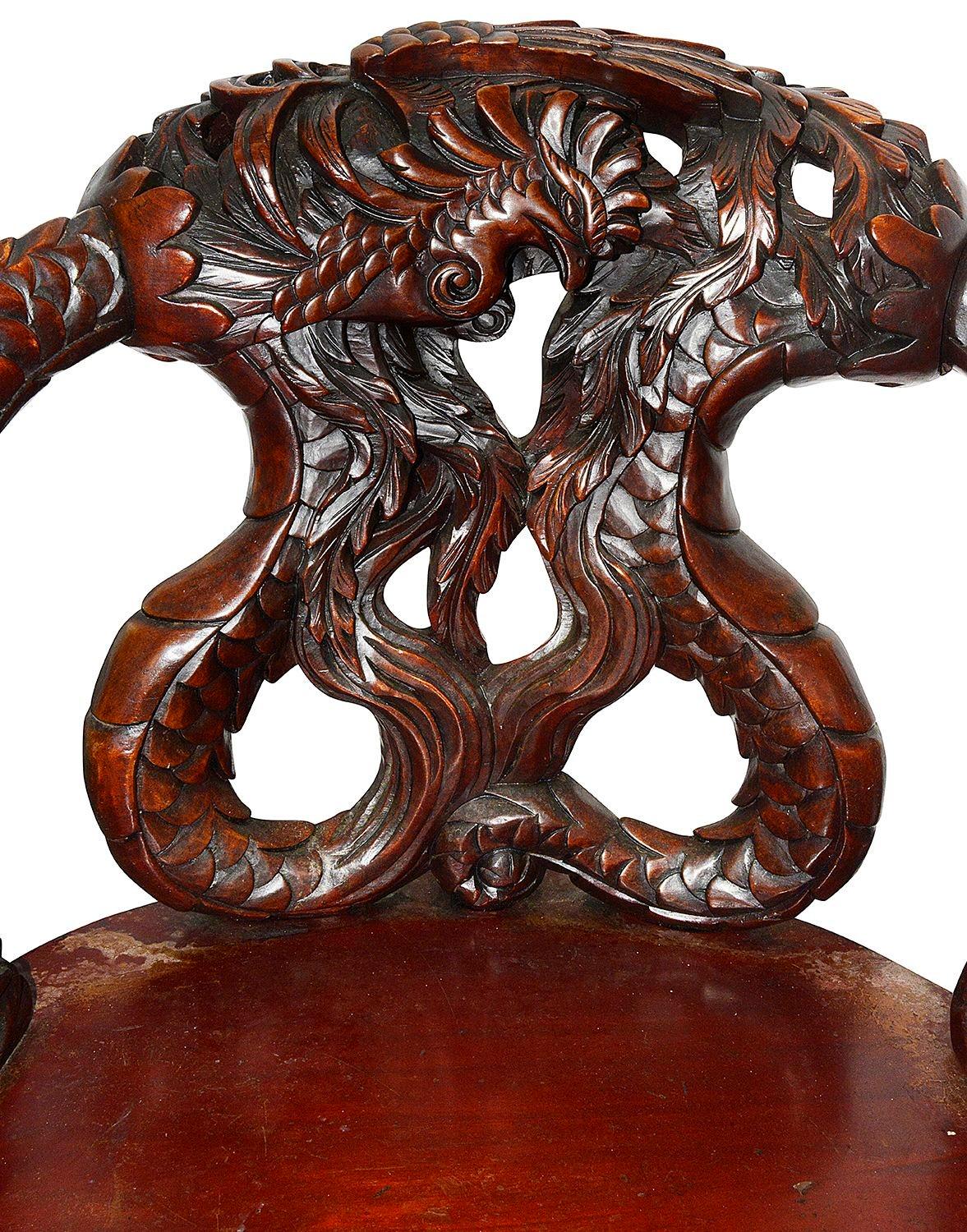 A very good quality late 19th Century Japanese carved wood arm chair with a pair of wonderful mythical dragons to the back rest and arms. Having a serpentine shaped seat and raised on winged cabriole legs.


Batch 75