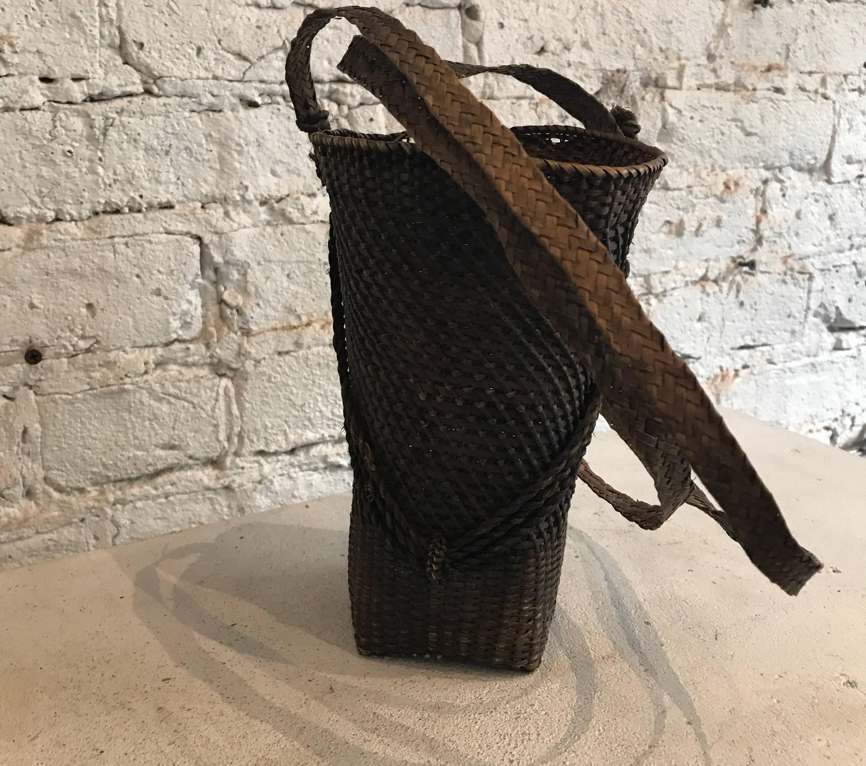 Late 19th century Japanese woven basket with woven strap.
Beautiful small hand-woven basket found in Kyoto Japan.



Dimensions: 7.25 in. H x 5 in. W x 4 in. D; hanging on wall by strap is 29 in. L.