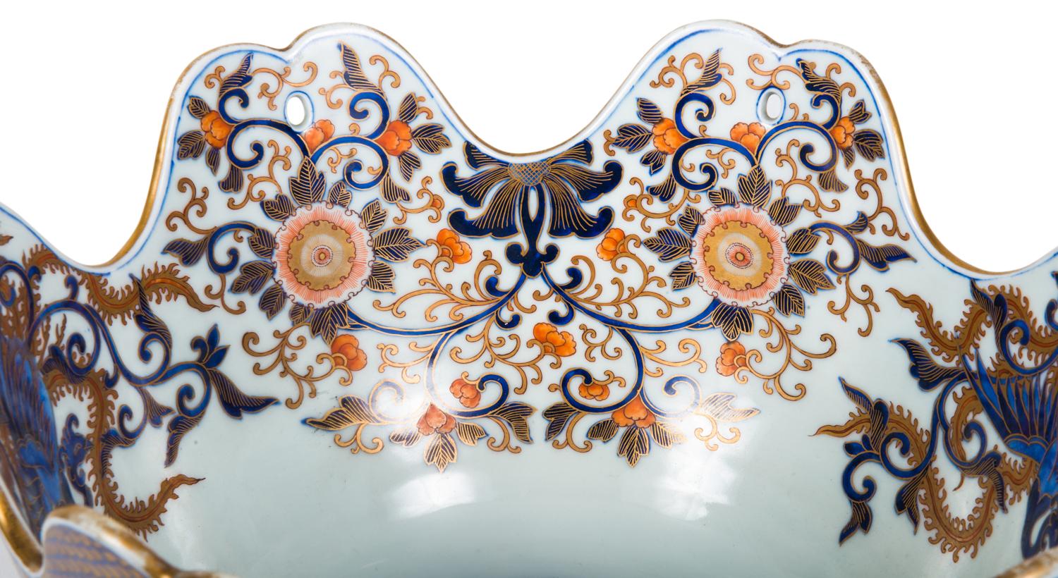 A good quality late 19th century Imari bowl having a shaped rim, with wonderful motif decoration with panels of painted blossom trees.