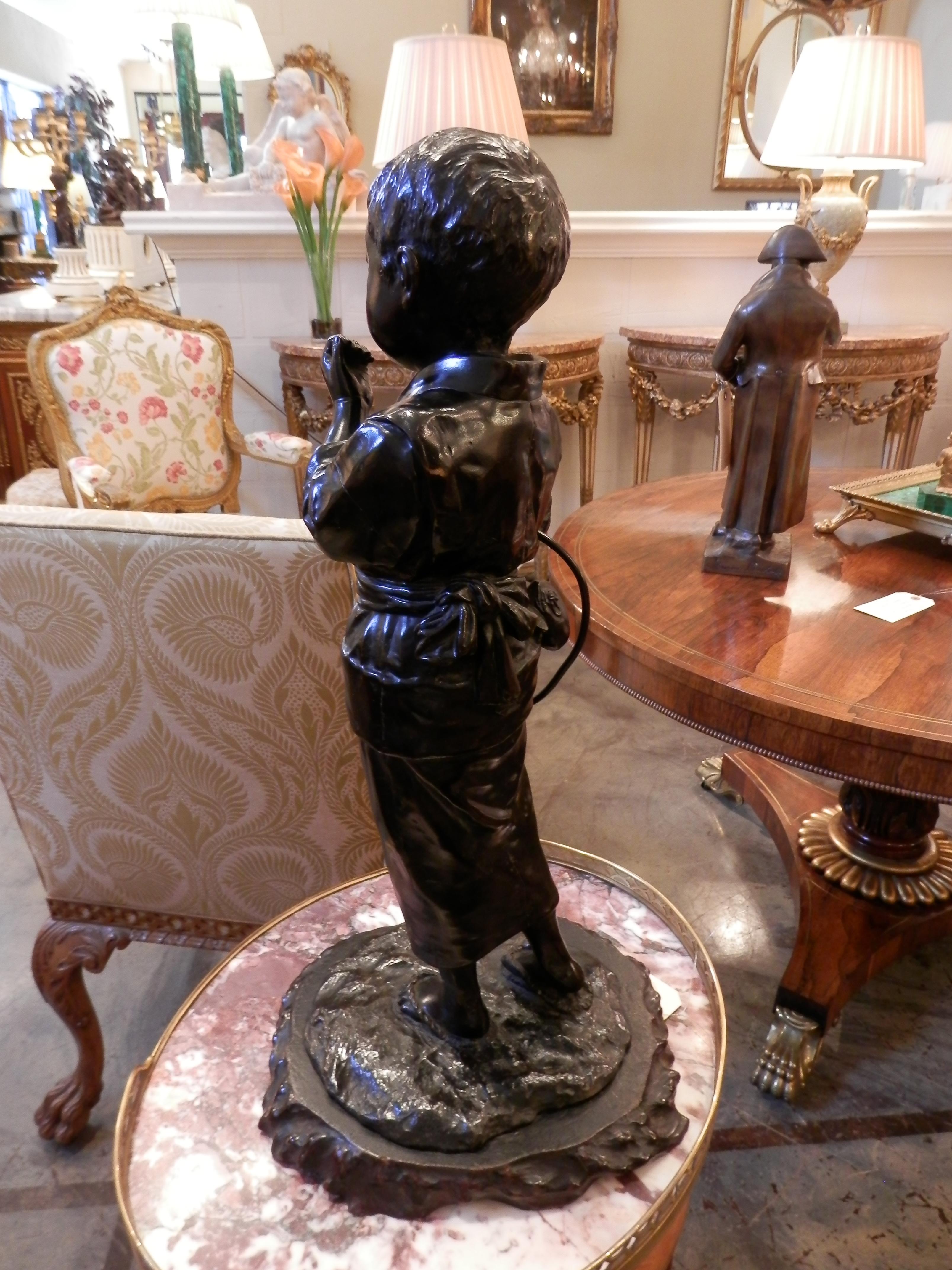Carved Late 19th Century Japanese Bronze of a Boy in a Kimono on a Naturalistic Base For Sale