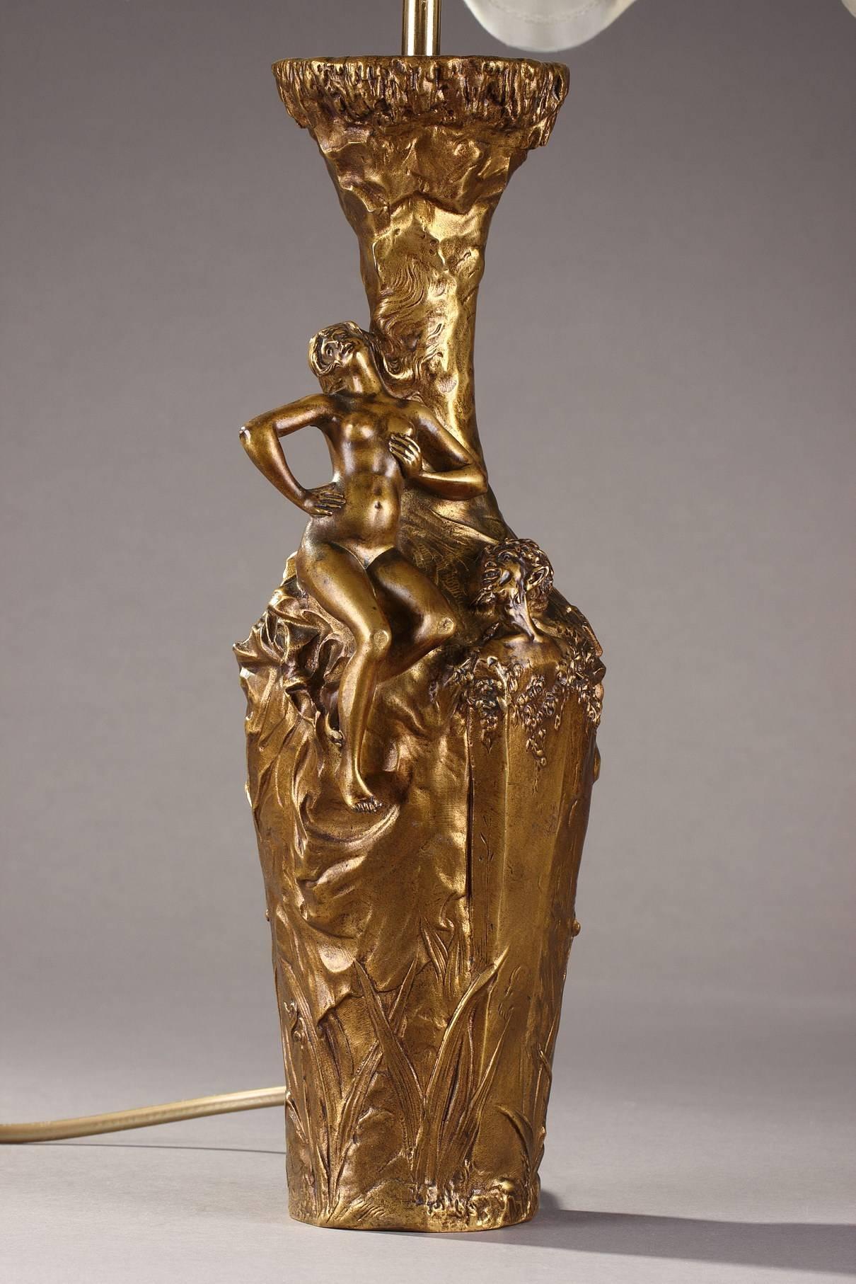 Gilt bronze sculptural vase by Jules Meliodon (French, 1867-after 1940), decorated with woman and satyr on a naturalistic background. Mounted as lamp and electrified. Signed Jules Méliodon and dated 1896. Marked Louchet underneath the base. Art