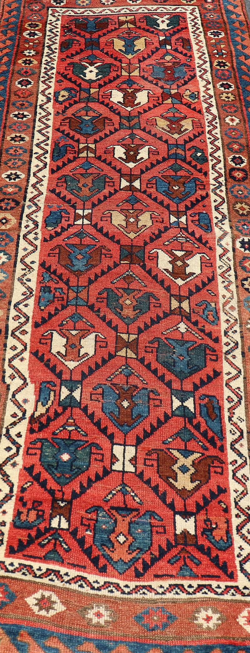 Wool Late 19th Century Kazak Runner Featuring All-Over Geometric Tribal Motifs For Sale