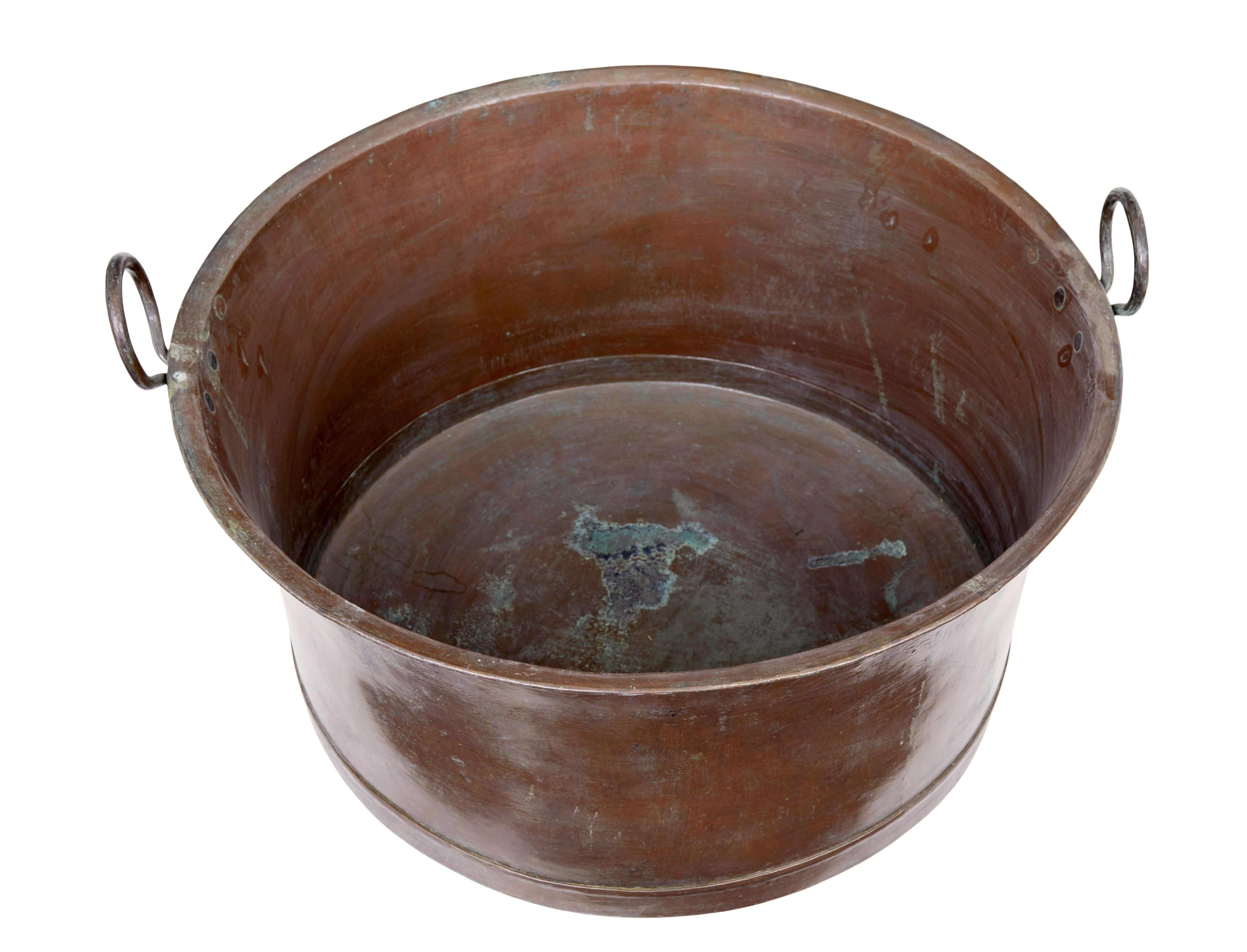 Late 19th century large copper cooking vessel circa 1890.

Large copper cooking pot with rounded bottom and looped handles. Ideal for today as use as a log bin or a cloakroom shoe tidy.

Expected surface marks, presented with it's original