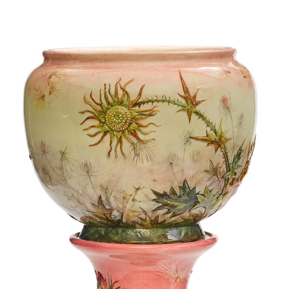A Large Delphin Massier Majolica Jardiniere On Pedestal.
Late 19th century
Each with painted mark Delphin Massier above Vallaruris: (A.M.).
height of jardinière 15in (38cm); height of stand 39in (99cm)

Maiolica /ma?'?l?k?/ is tin-glazed