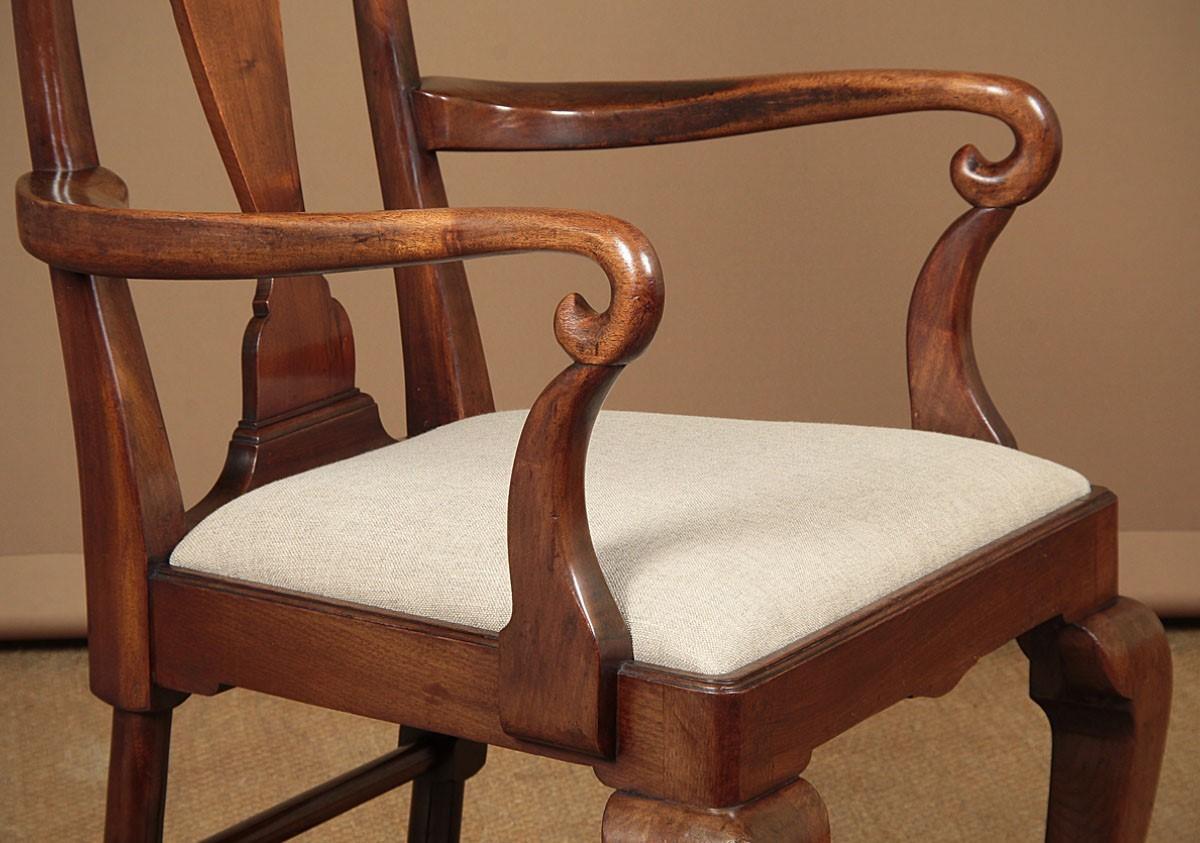 Large Victorian or early Edwardian solid mahogany open armchair of superb quality. This sturdy substantial chair has an unusual cresting rail with curving horns over a lovely shaped baluster silhouette backsplat. Graceful curving arms with crook