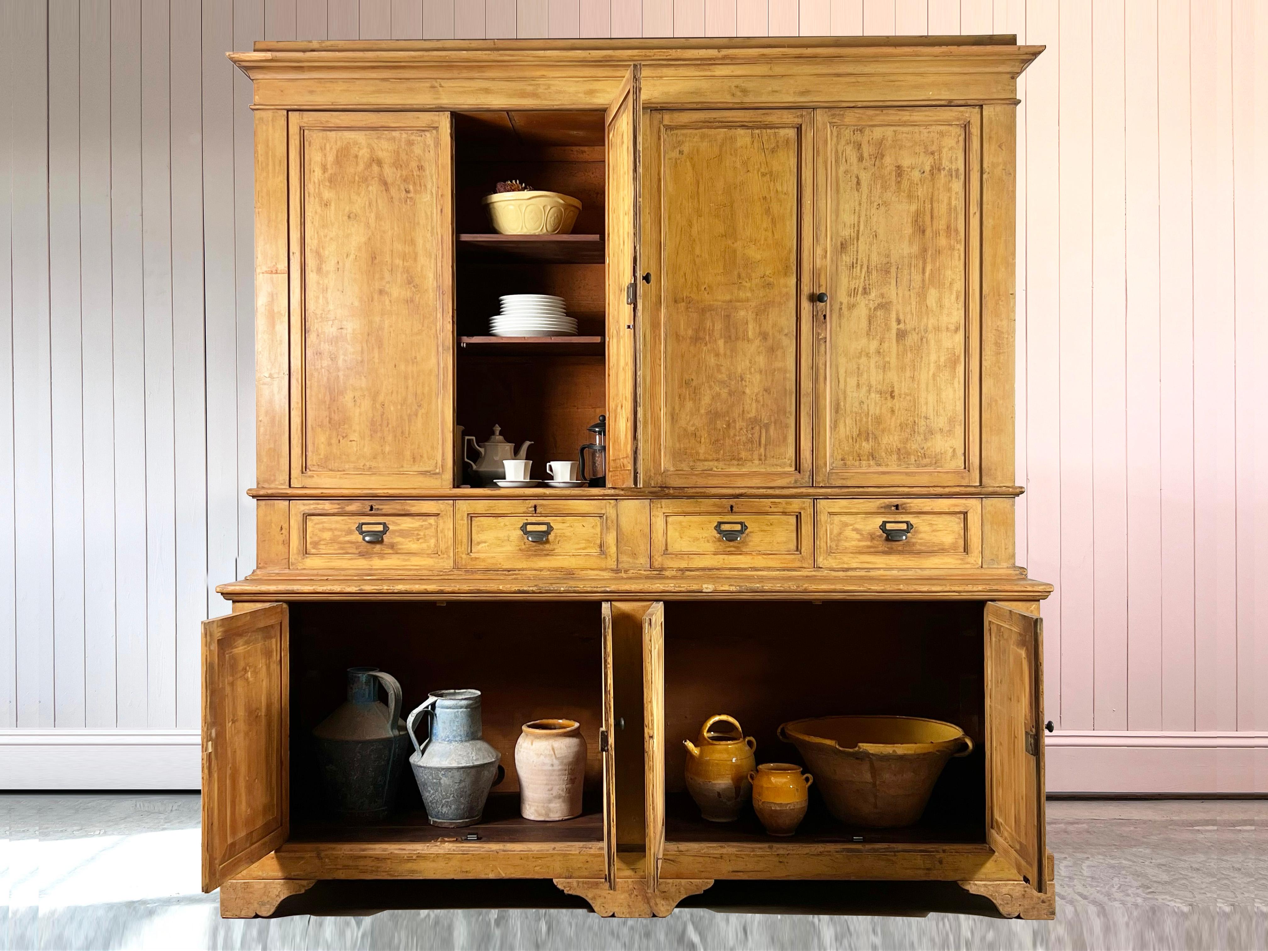 This Late 19th Century cupboard was sourced from some offices in Bologna.

It is a very handsome piece of furniture with rather Georgian proportions.  It is painted pine with lots of natural wear and patina.

The inside was originally fitted out