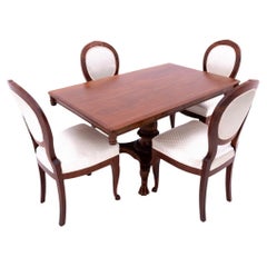 Late 19th century lion's paw table with chairs, Northern Europe.