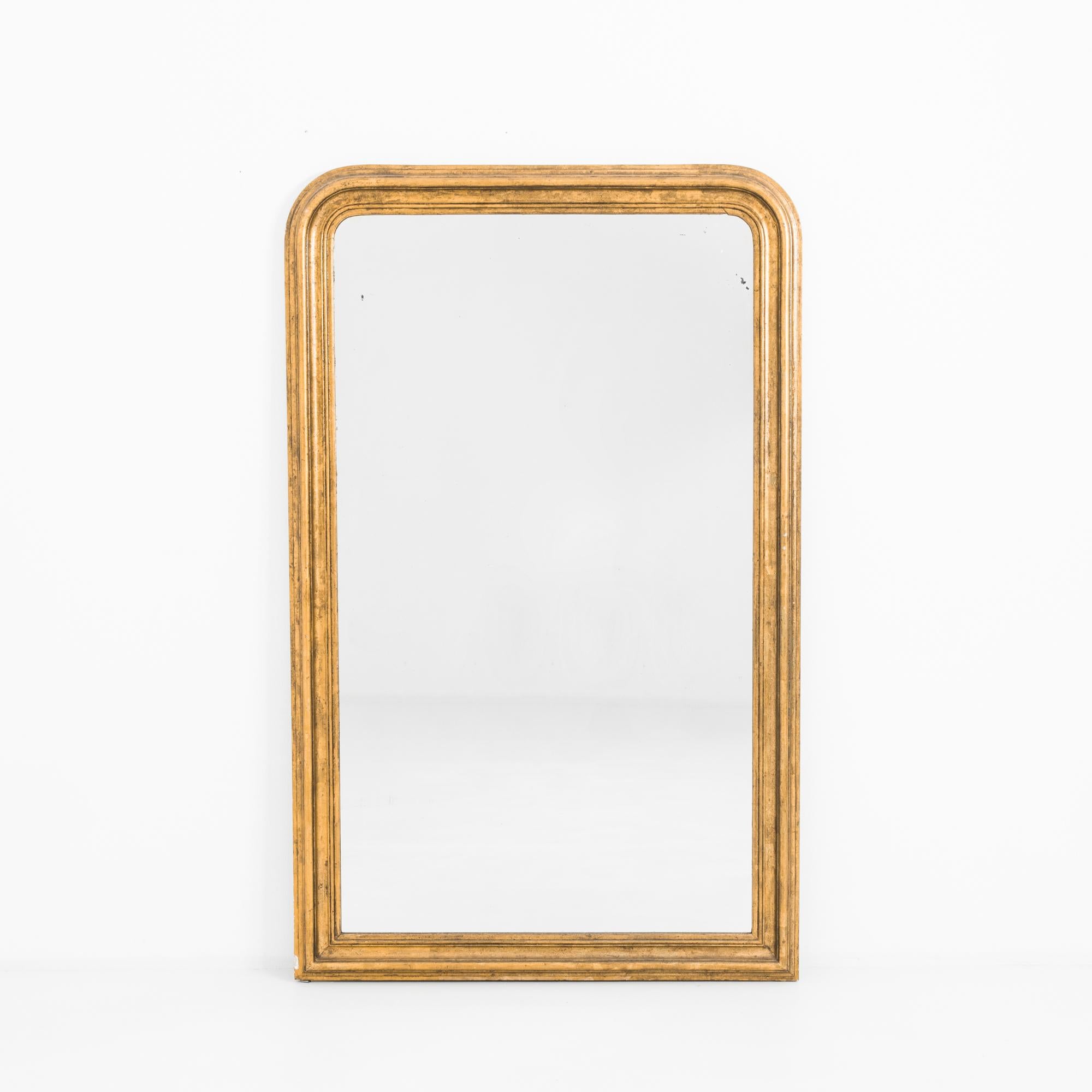 In a typical Louis Philippe style, this elegant arched frame, charms in spaces simple or ornate. From France, circa 1880. Finely crafted with traditional techniques from European oak, plastered, painted, and carefully gold-leafed. A neoclassical