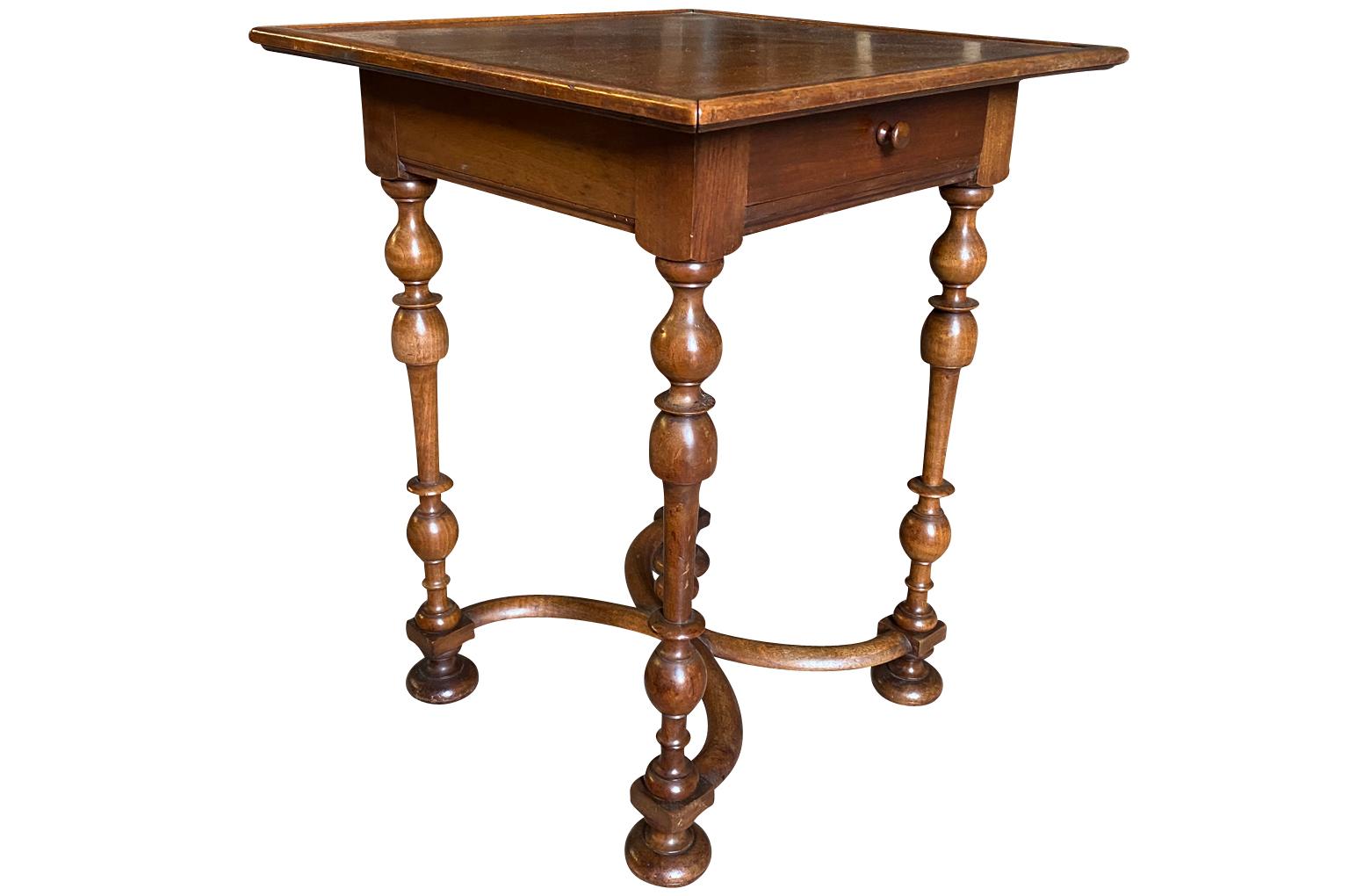 A very lovely later 19th century Louis XIII side table beautifully constructed from walnut with a single drawer and wonderfully turned legs. Very rich patina.