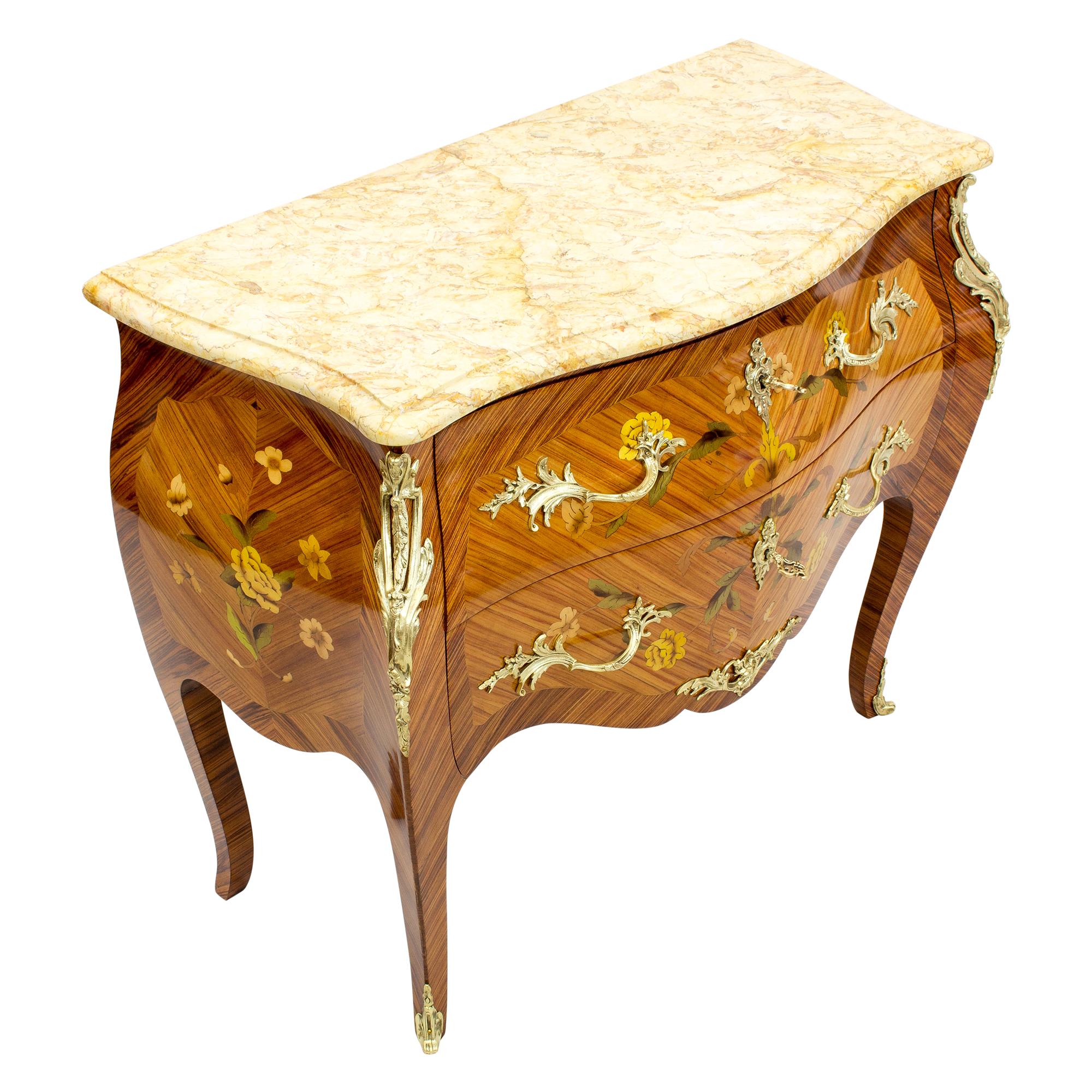 Fine French late 19th century Louis XV style around 1890 fruitwood floral marquetry and bronze mounted two drawer bombe petit commode. 
The serpentine shaped chest of two drawers, each with a pair of scrolled floral handles and a marquetry floral