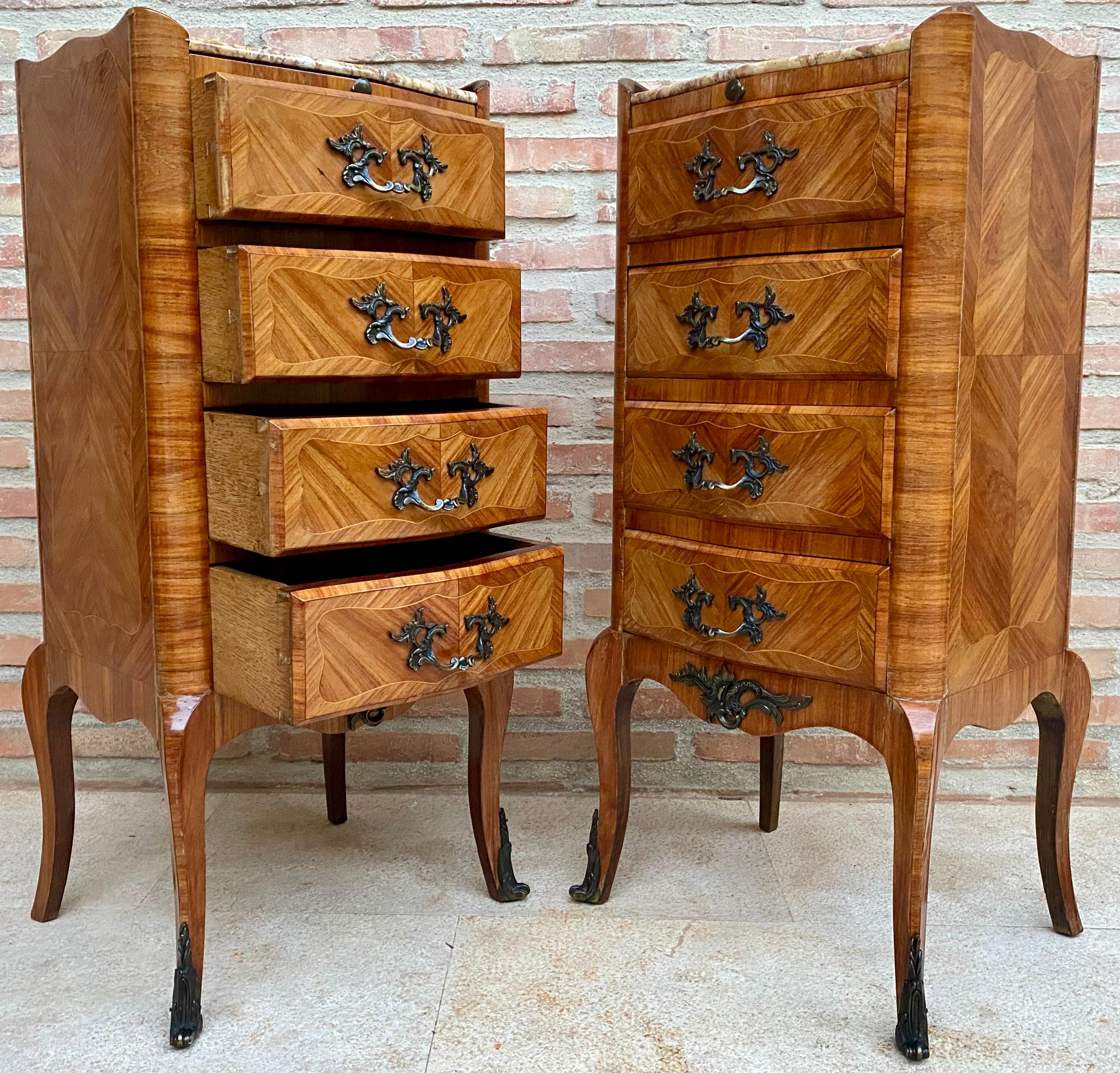 Beautiful French Louis XV style walnut marquetry from the late 19th century and marble chest of drawers from the 1890s. 
Marble top, beautiful marquetry on the drawers and on all sides of the dressers. 
They have a removable tray covered in green